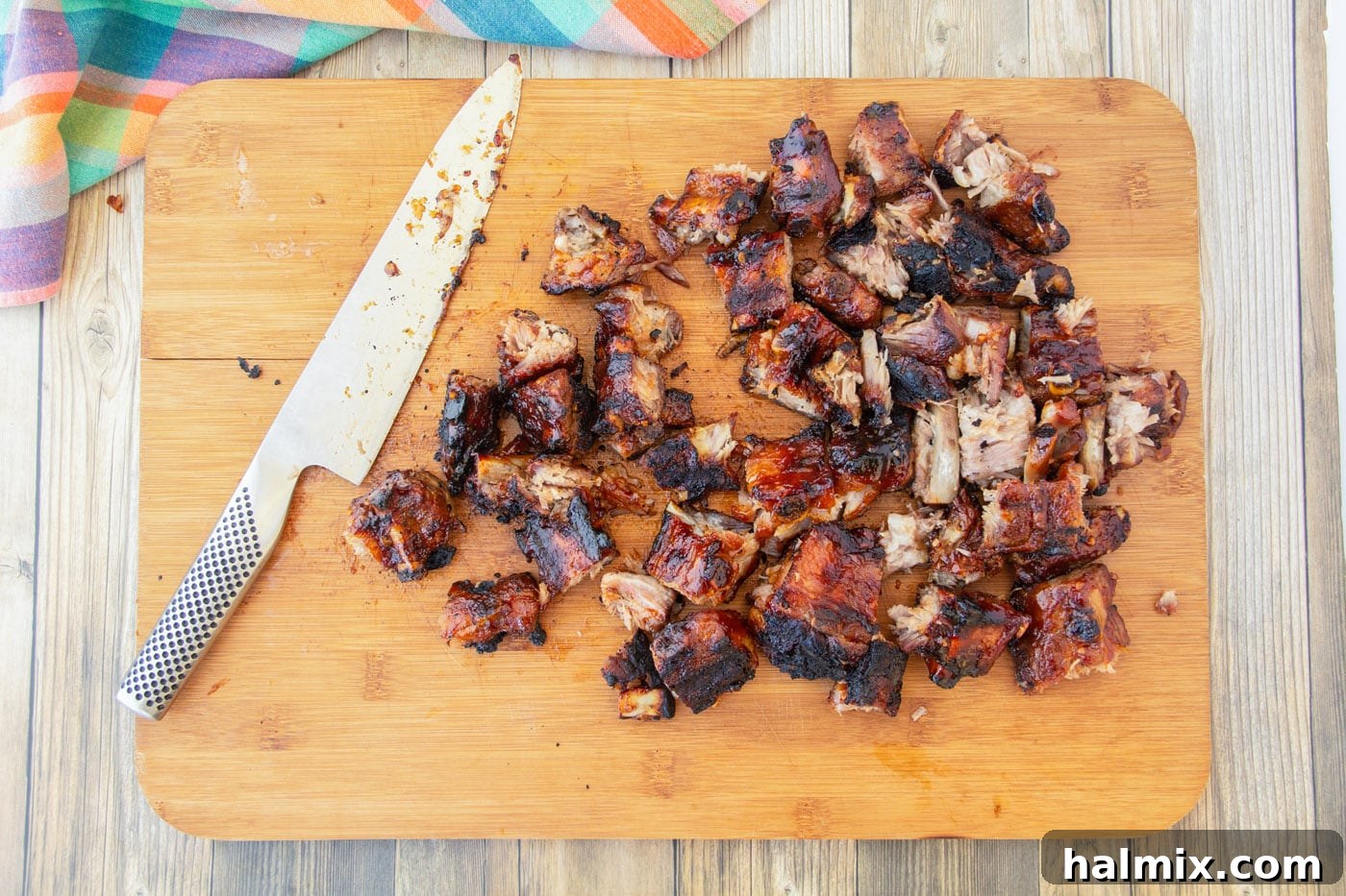 Smoked Rib Nuggets 7 chopped rib tips on a cutting board, garnished.