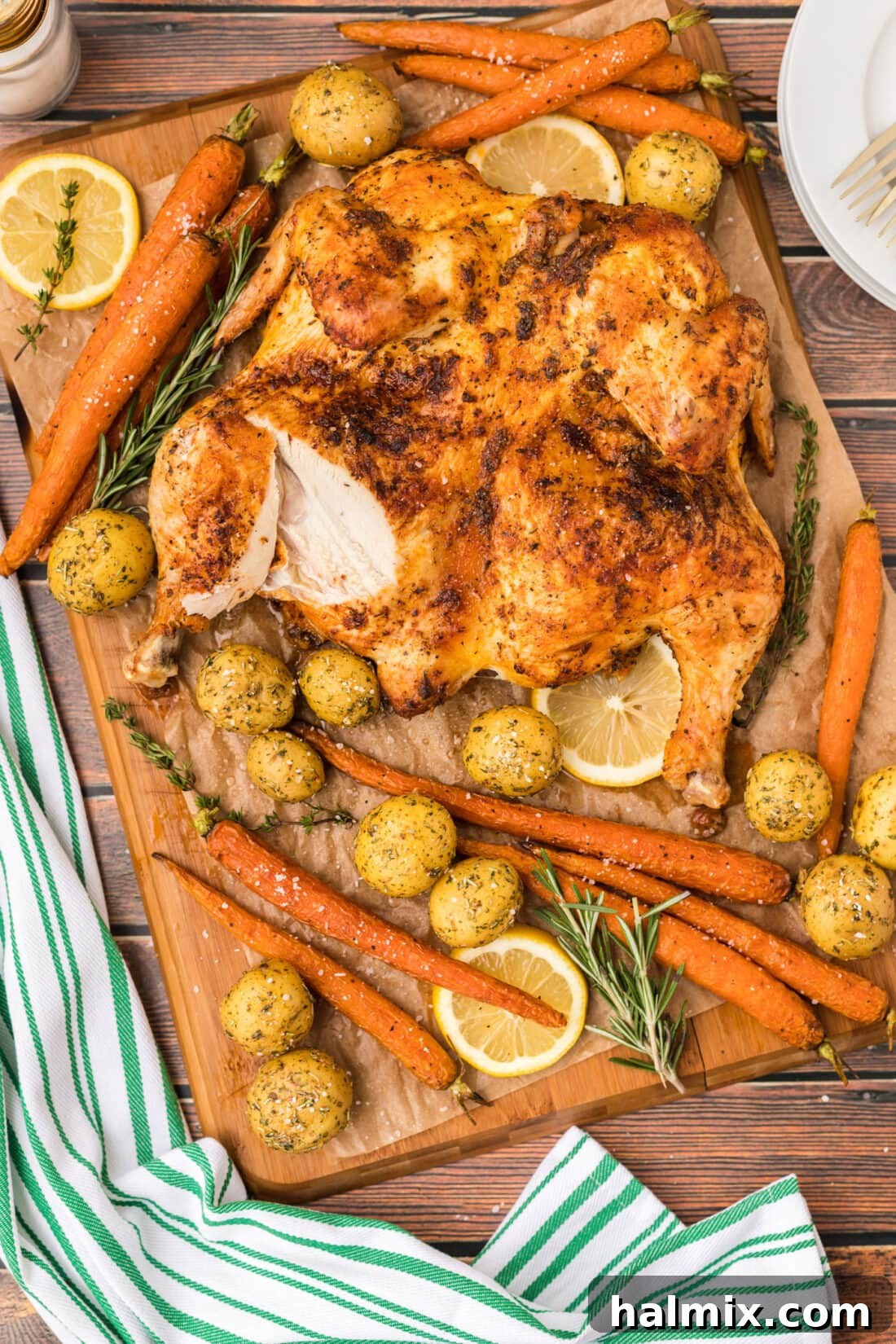 Spatchcock Chicken with a slice removed, showing juicy interior