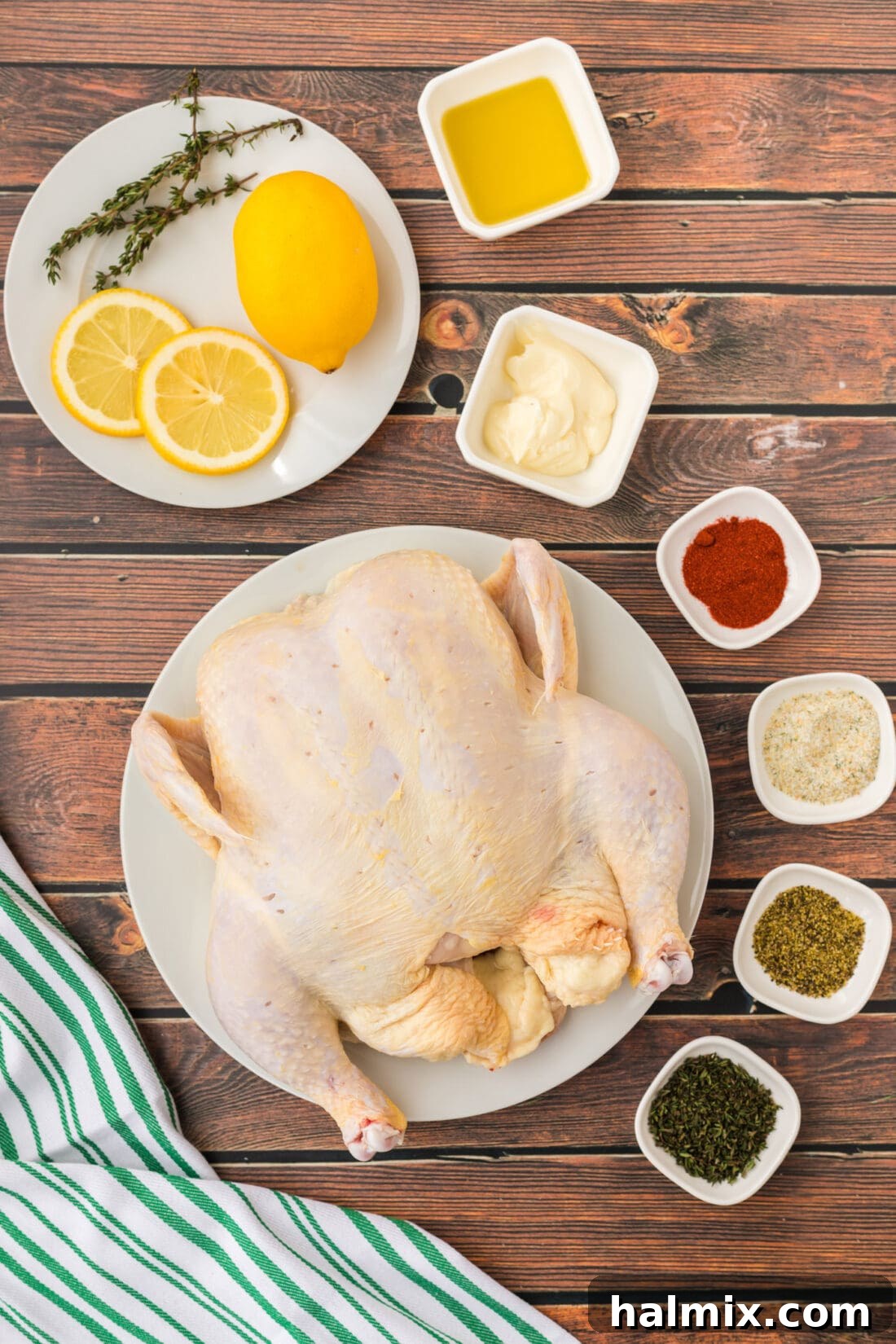 Various ingredients for Spatchcock Chicken including spices, oil, and butter