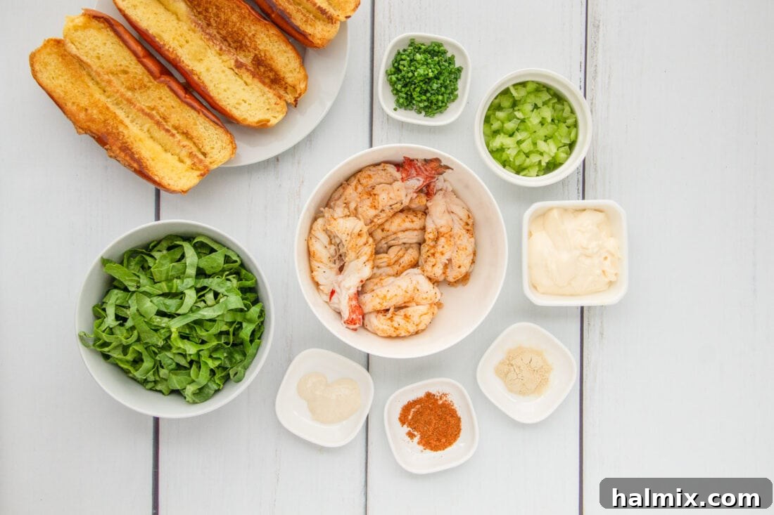 Fresh ingredients laid out for making lobster rolls, including lobster tails, celery, chives, and mayonnaise