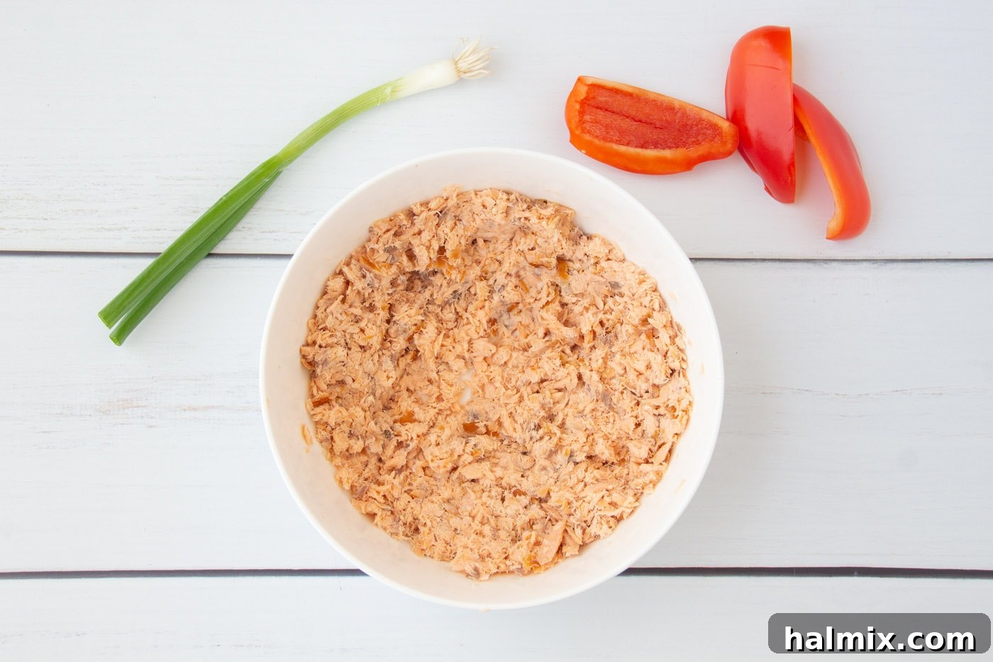 Flaked smoked salmon in a bowl