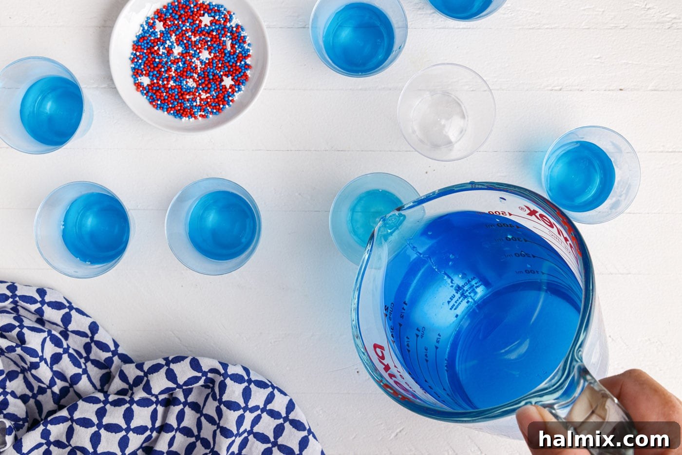 pouring jello into a shot glass