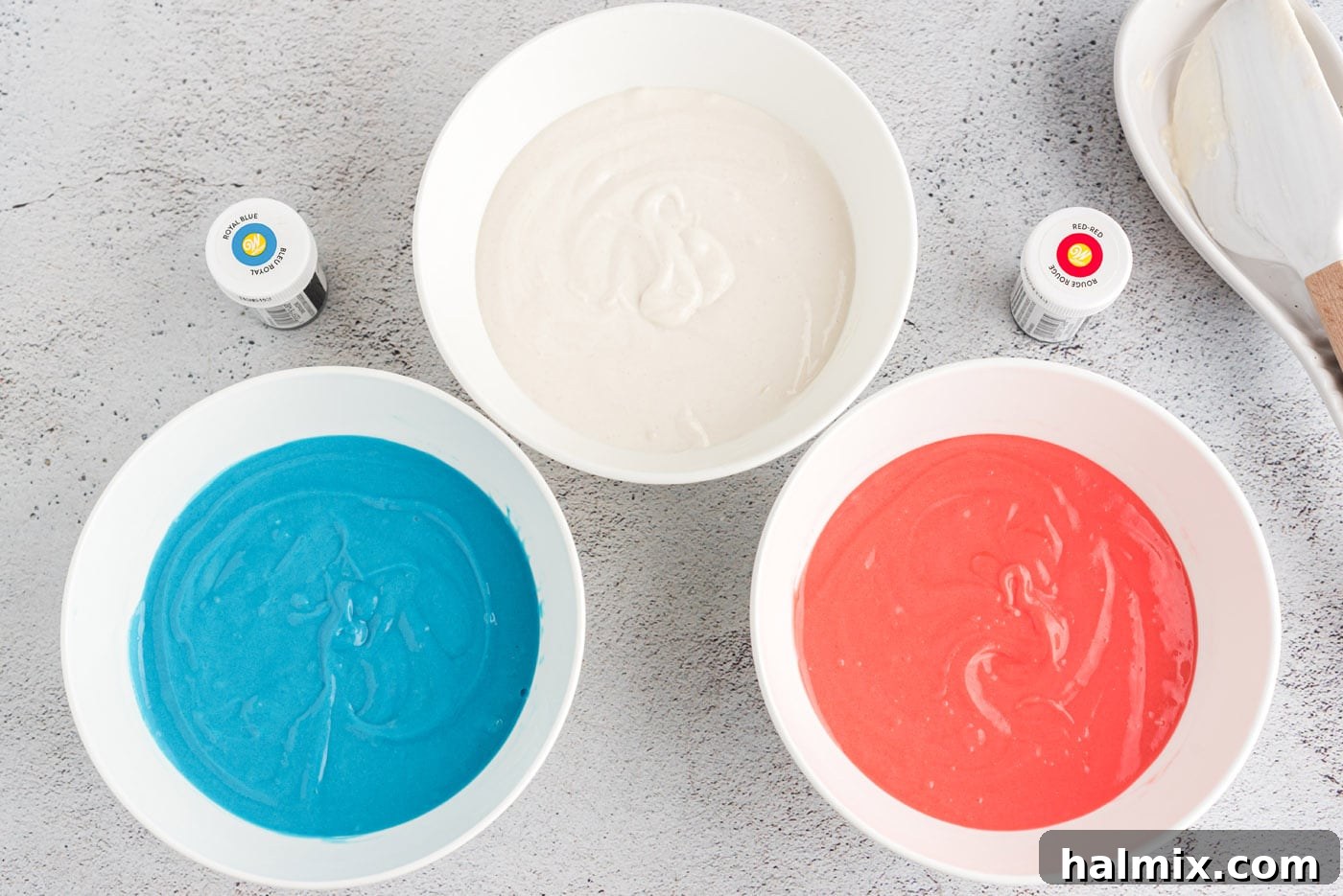 Stars and Stripes Cone Cakes 5 Colored cake batter in three bowls: red, white, and blue