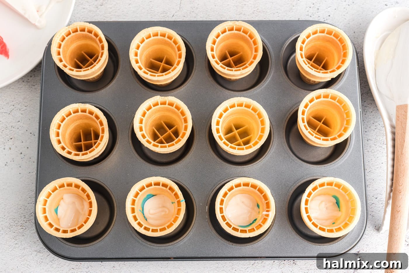 Stars and Stripes Cone Cakes 6 Clear view of cake batter being poured into an ice cream cone