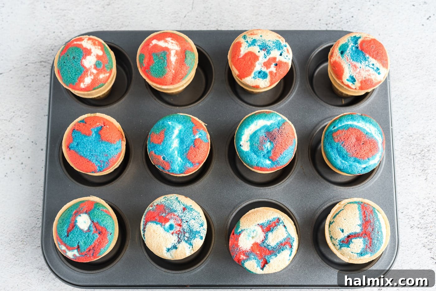 Stars and Stripes Cone Cakes 10 Freshly baked patriotic ice cream cone cupcakes cooling in a cupcake pan