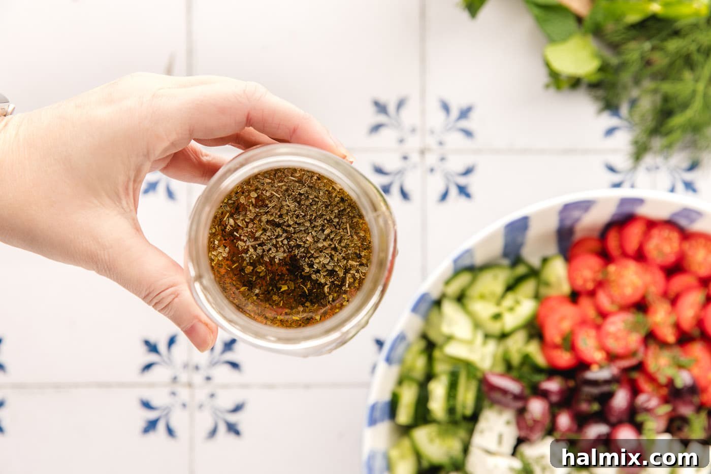 lemon, olive oil, and red wine vinegar salad dressing in a jar