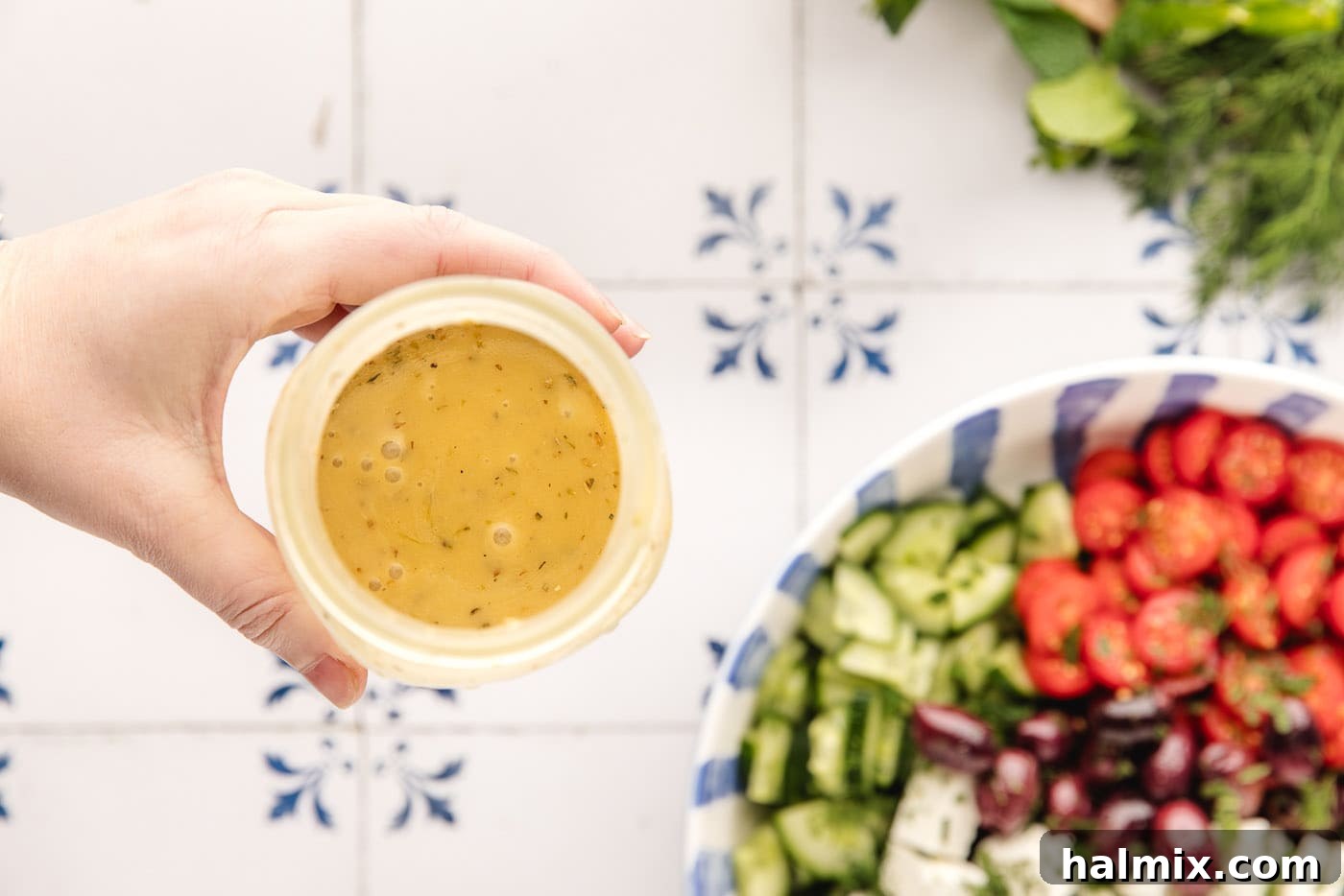blended Greek salad dressing in a jar