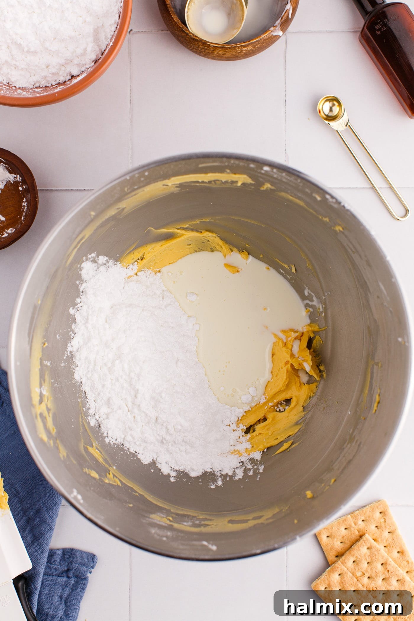 Powdered sugar and custard powder in a mixing bowl for the filling.