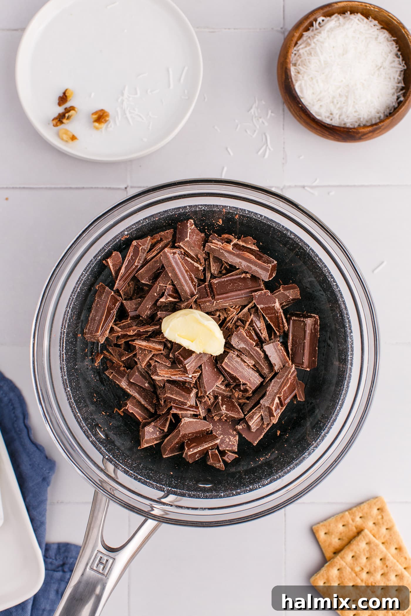 Semi-sweet chocolate and butter melting in a bowl over the stovetop.