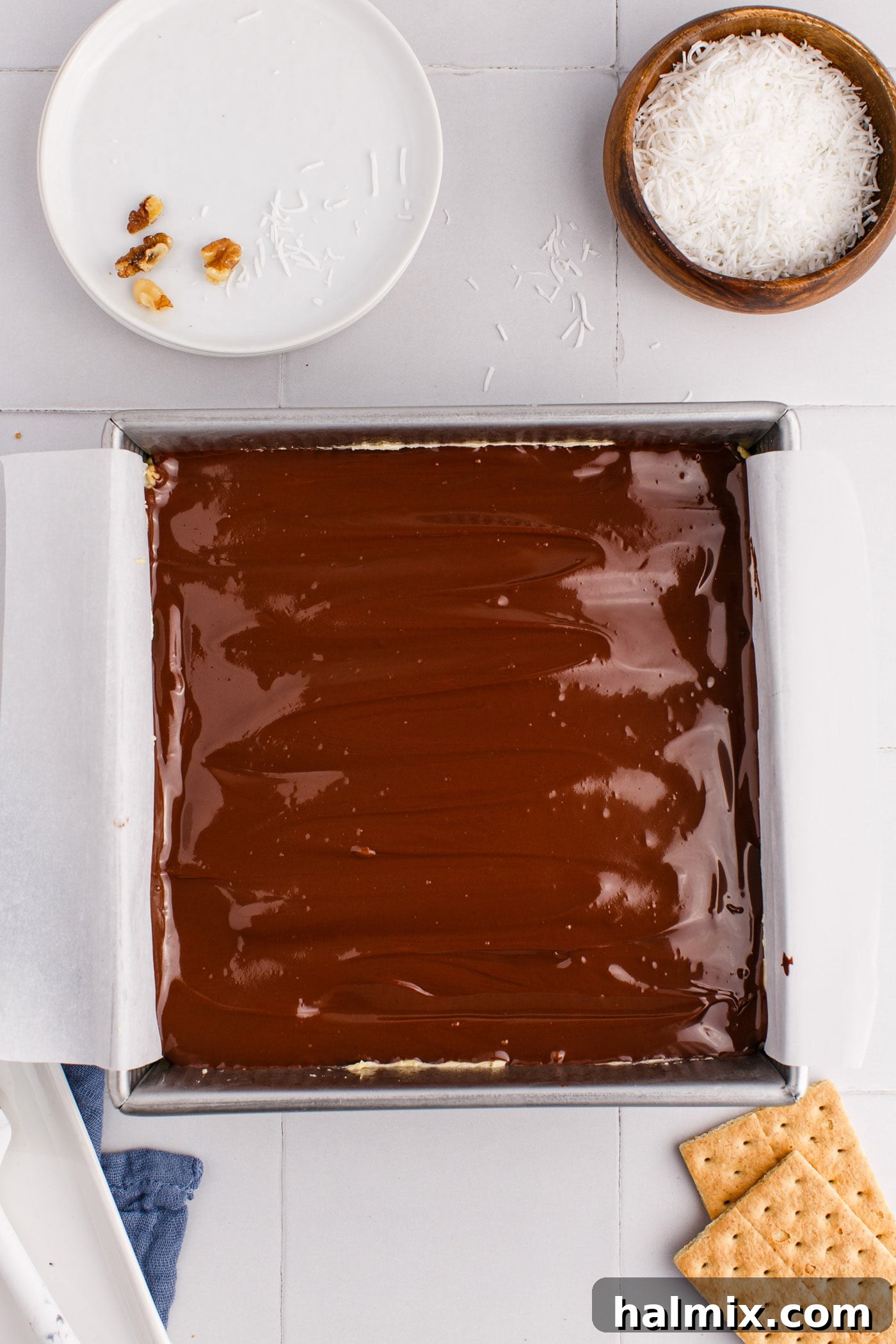 Melted chocolate spread over the custard layer of the Nanaimo bars.
