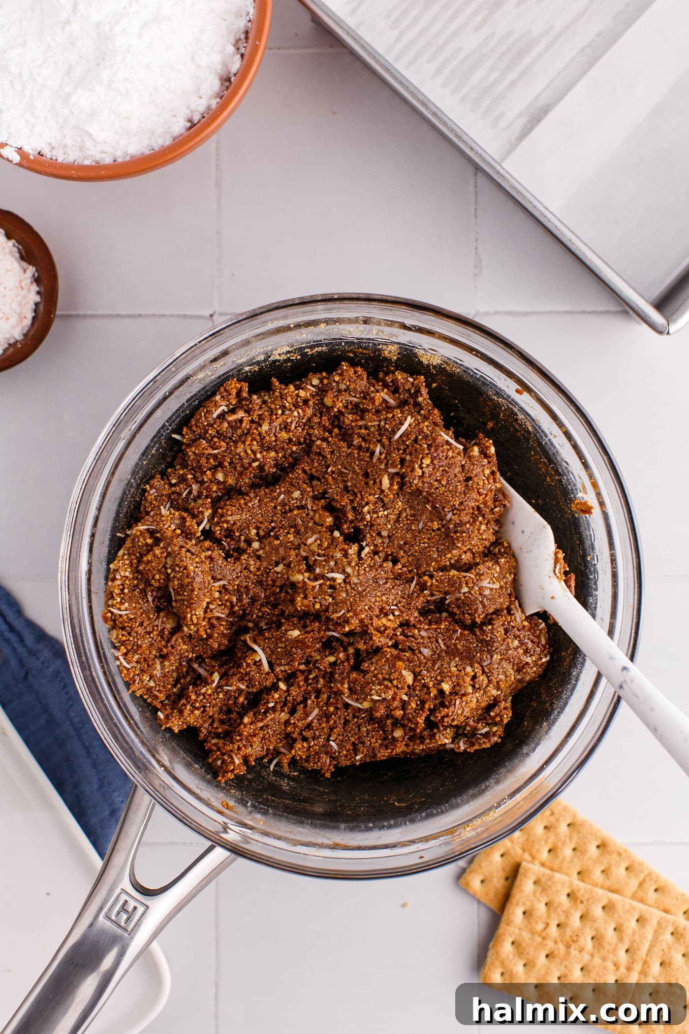 The fully combined coconut graham crust mixture in a bowl.