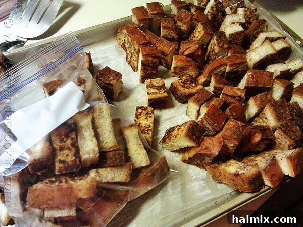 Cooling French Toast Sticks Before Flash Freezing A close-up photo of perfectly golden brown homemade freezer French toast sticks cooling on a wire rack.