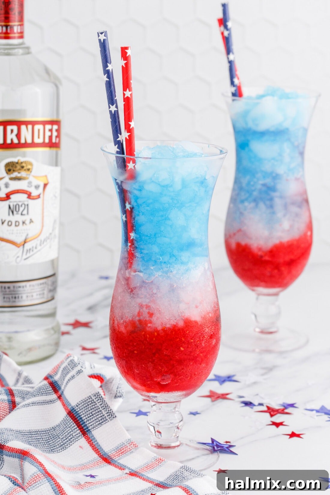 Freedom's Frosty Vodka Lemonade 2 2 glasses of Patriotic Vodka Lemonade Slushie ready to be served at a patriotic celebration.