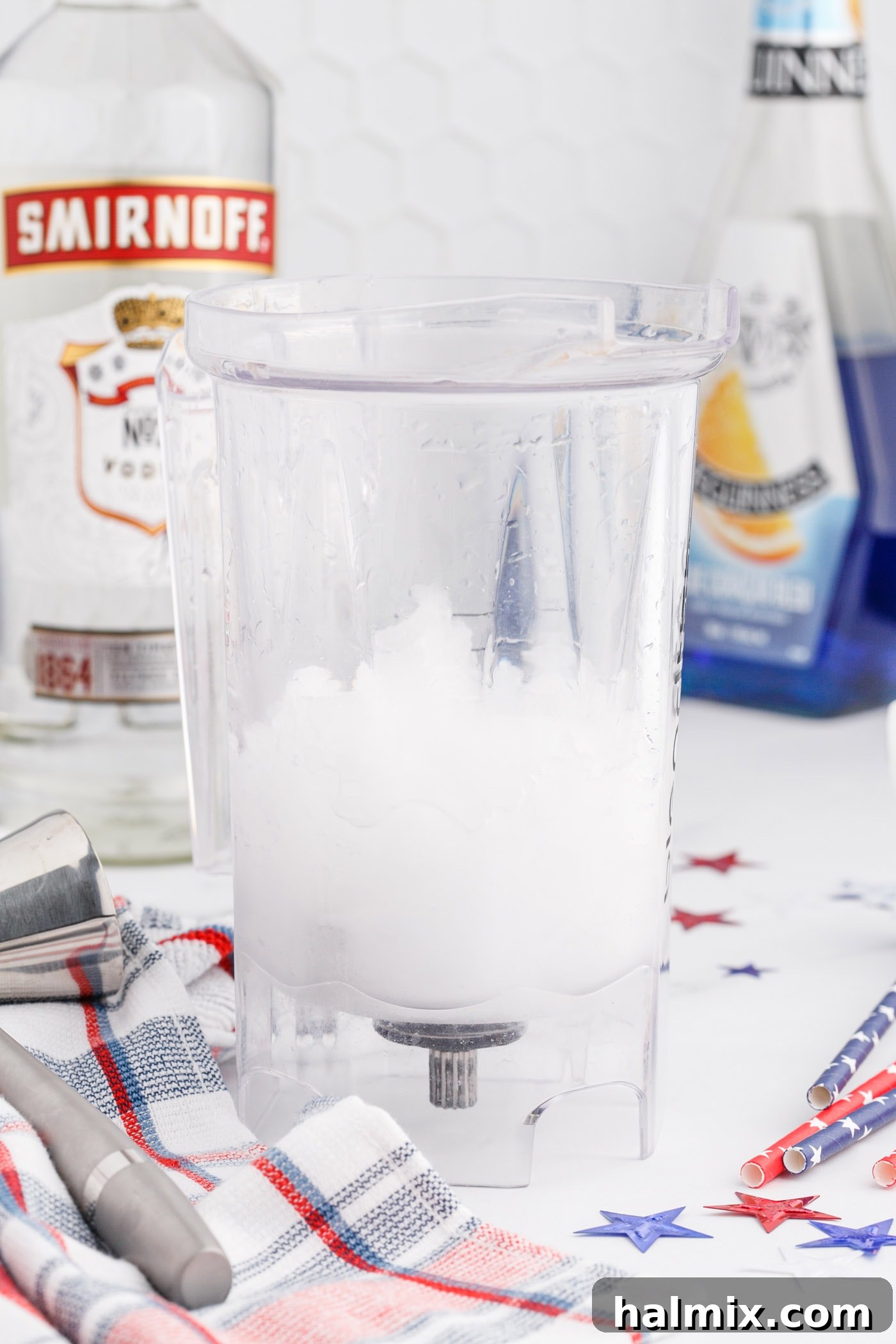 Vodka lemonade slush in a blender, forming the white layer of the patriotic drink.