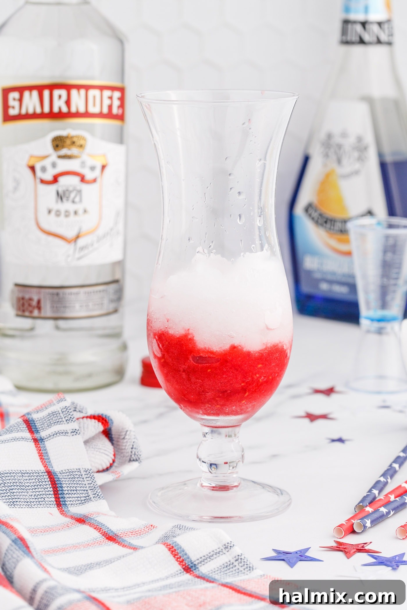 Freedom's Frosty Vodka Lemonade 9 Raspberry slush with lemonade slush on top, showing the initial red and white layers in a glass.