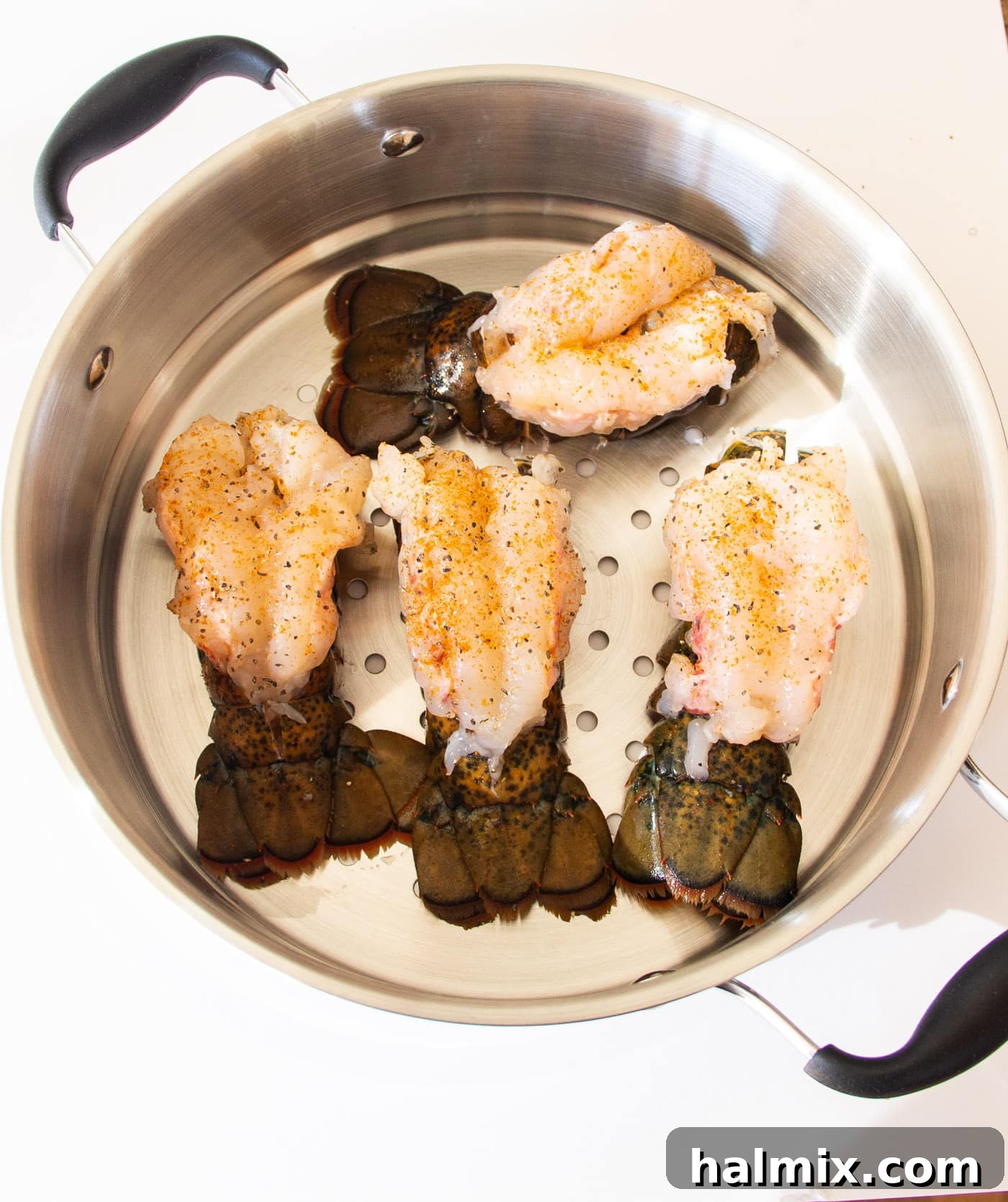 crowned lobster tails in a steam pot