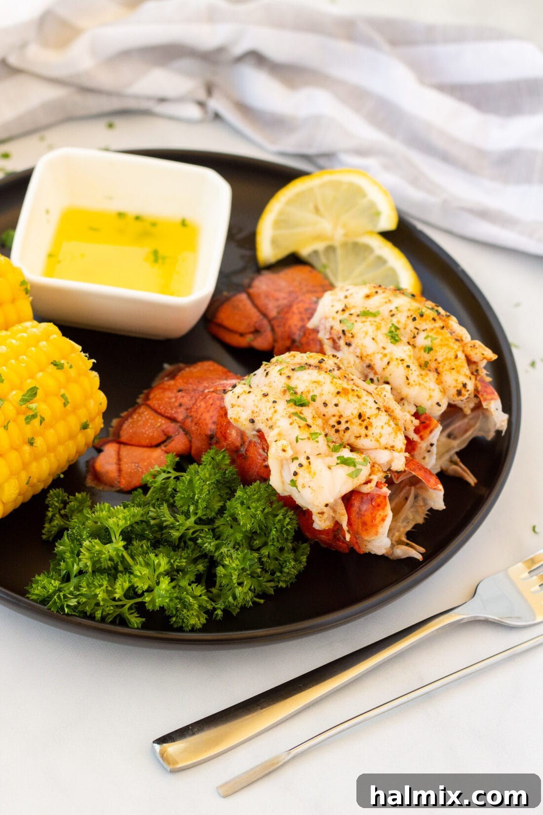 2 Steamed Lobster Tails on a plate