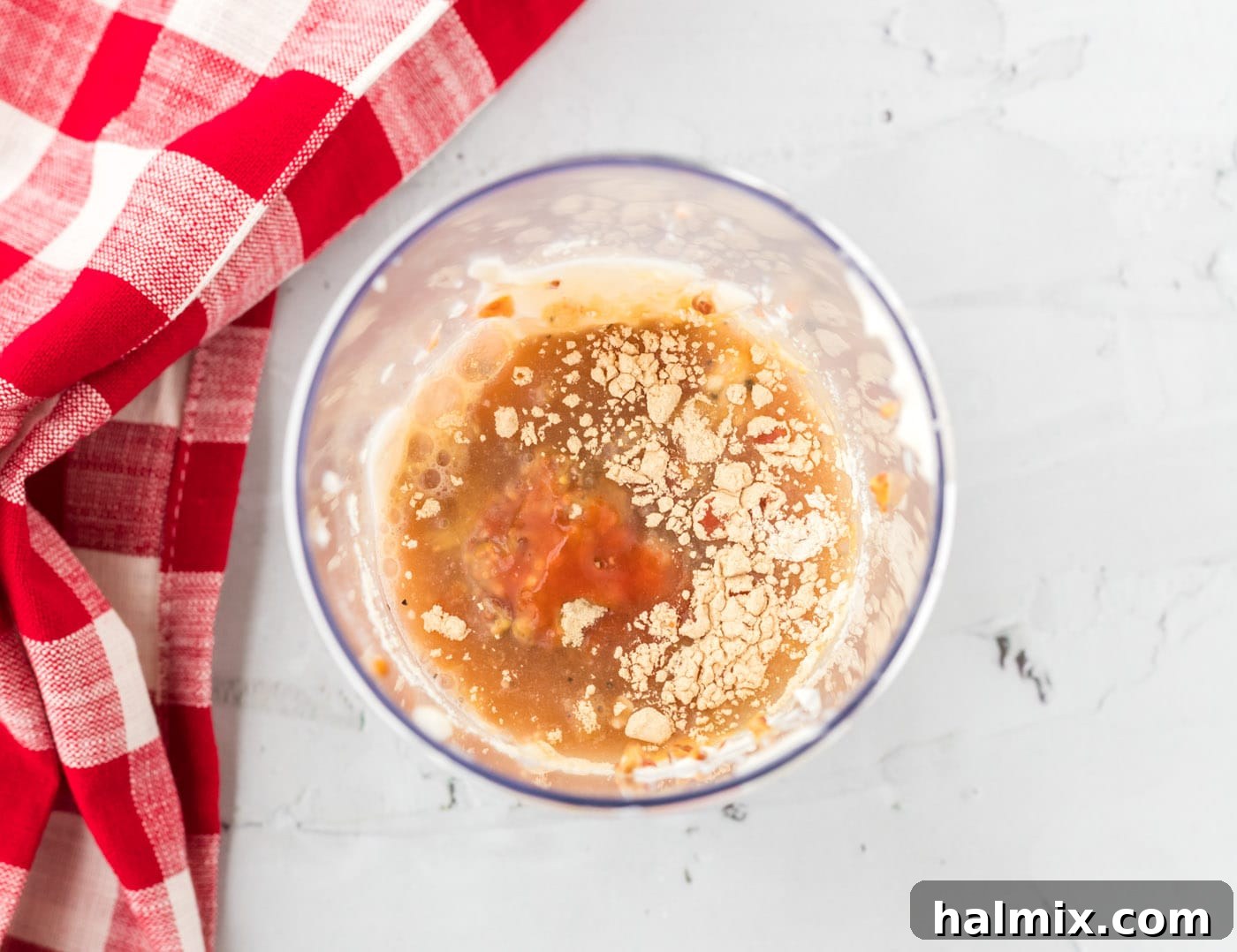 All ingredients for Alabama white sauce in a jar, ready for blending.