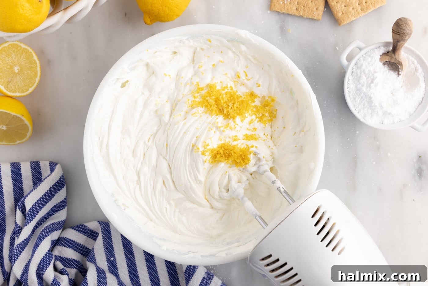 mixing in lemon zest to cream cheese