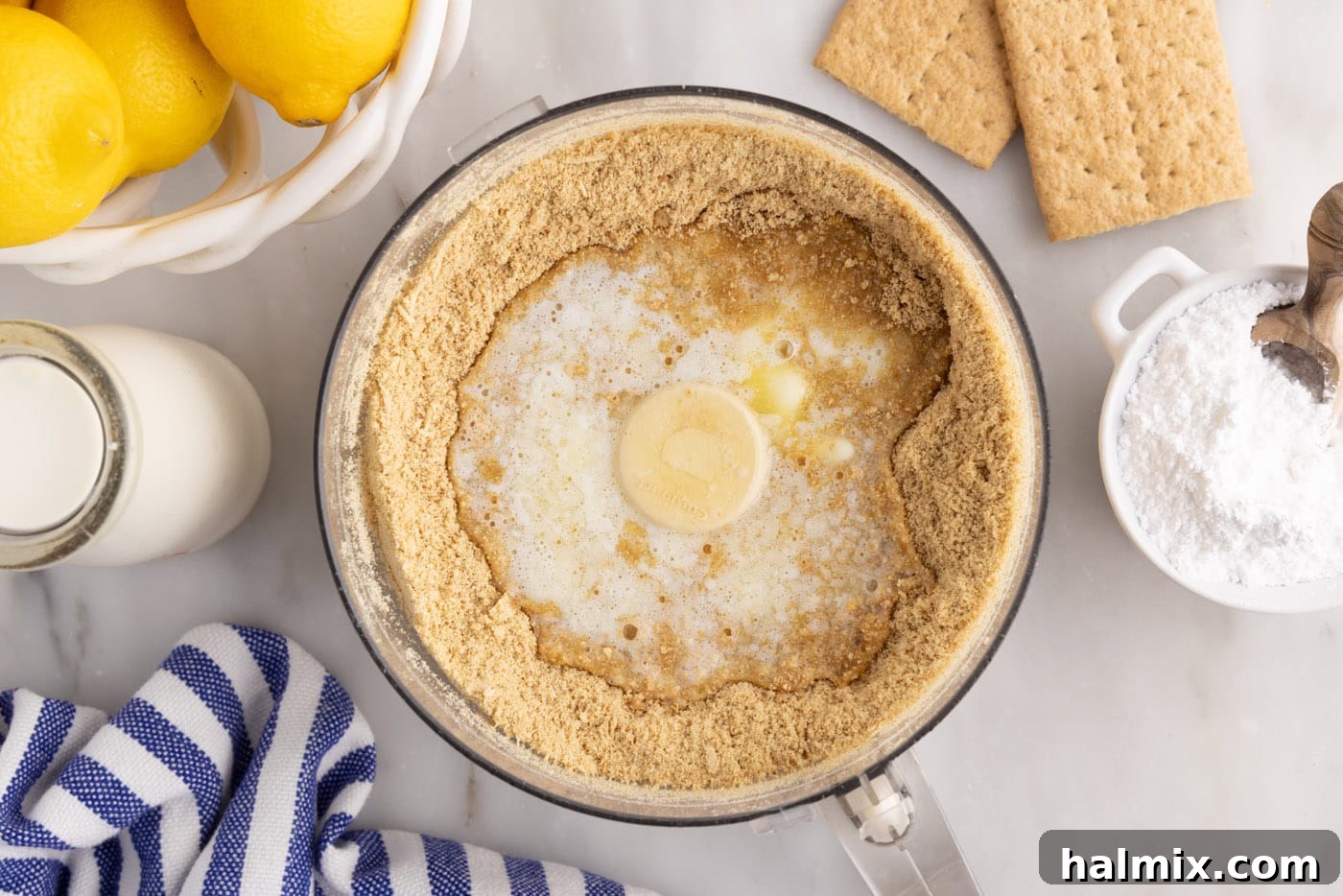 graham cracker crumbs and melted butter in a food processor