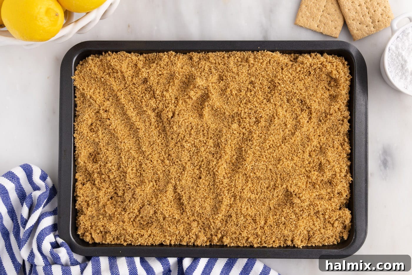 graham cracker crumbs on a baking sheet