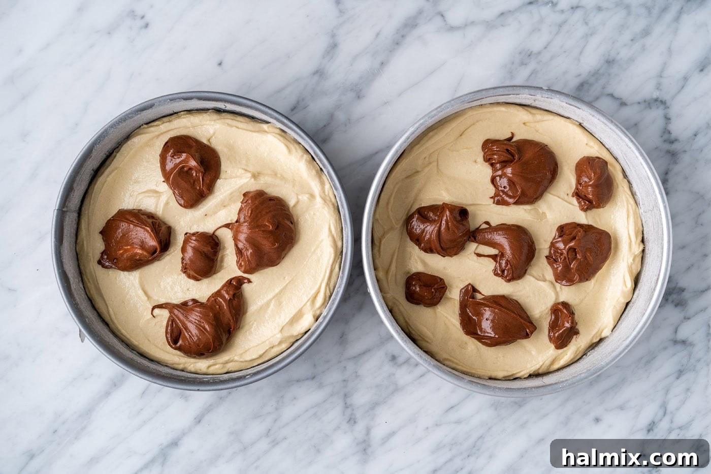 Swirled Delight 12 yellow cake batter in pans with dollops of chocolate cake batter on top