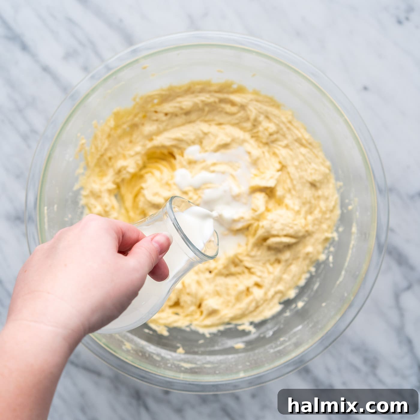 Swirled Delight 9 adding milk to the yellow cake batter mixture during the alternating step
