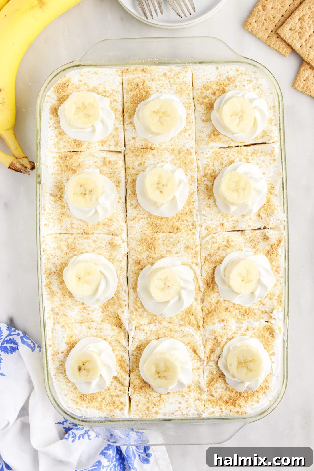Overhead view of a Banana Cream Pie Icebox Cake, sliced and ready to serve.