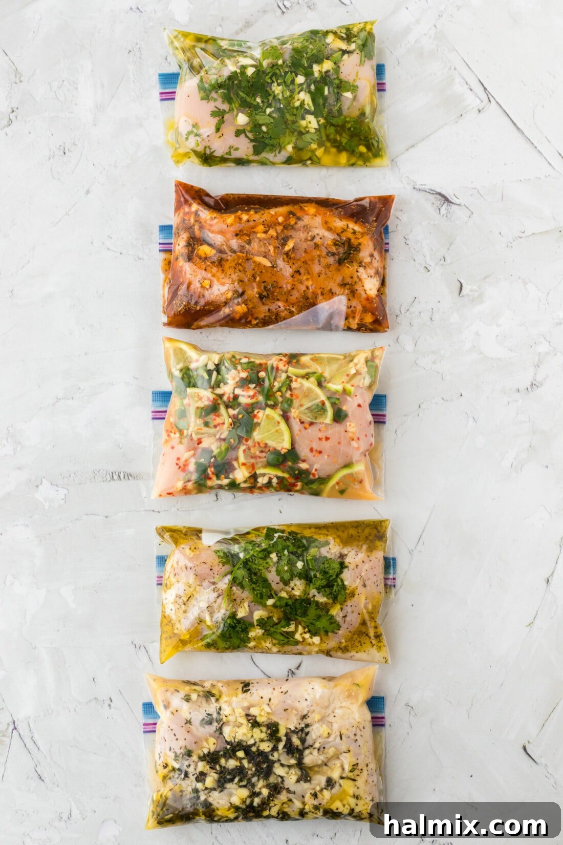 Five bags of chicken marinating, showcasing the variety of flavors
