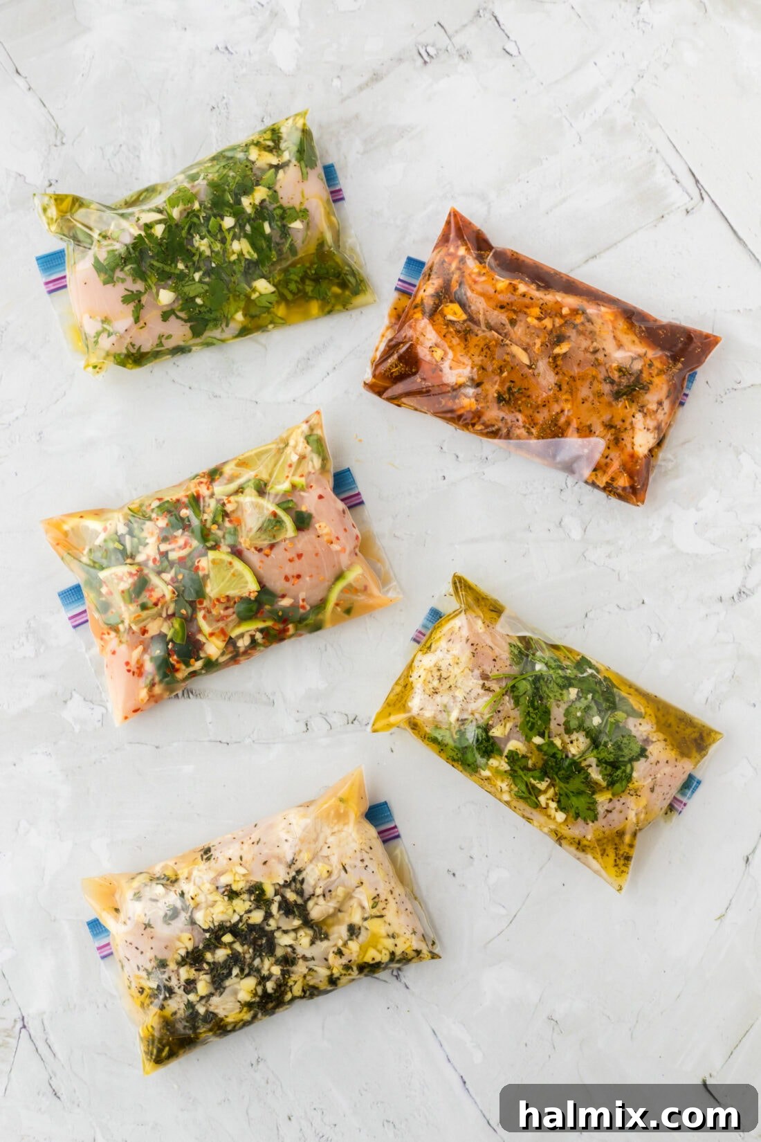 Five bags of chicken in marinade, displaying fresh ingredients