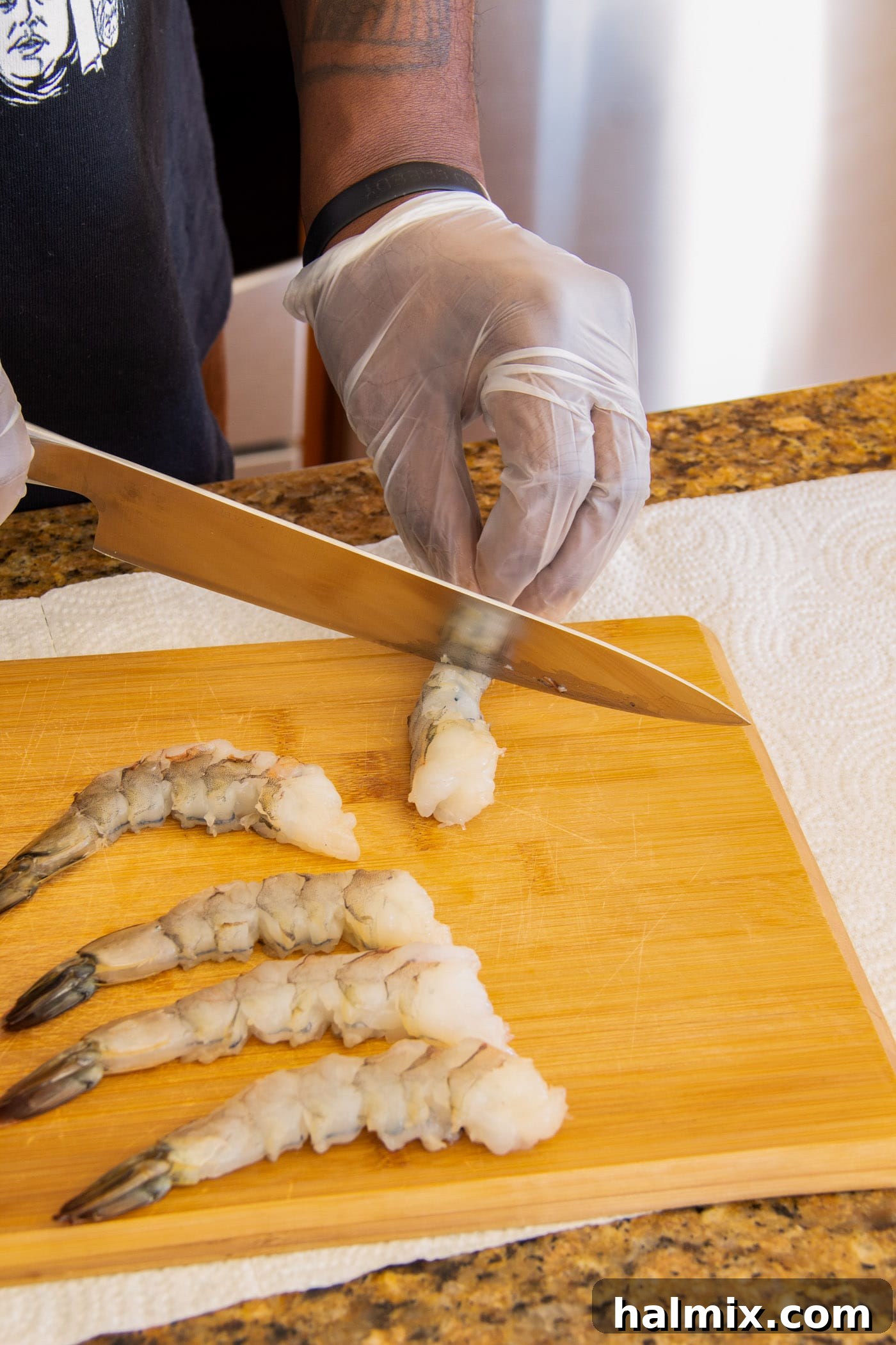 Crunchy Ocean Gems 5 scoring shrimp with a knife