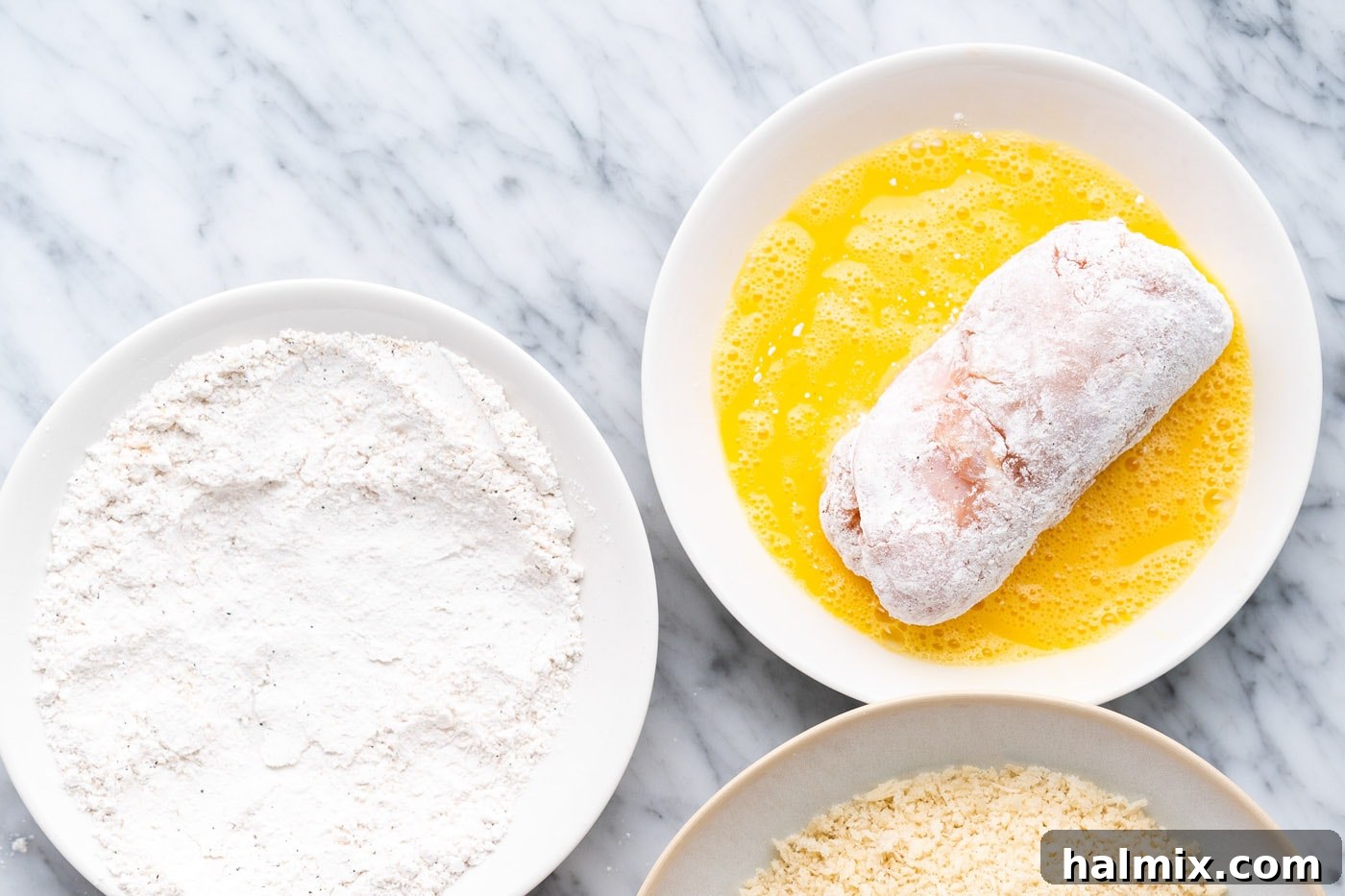 Crispy Air Fryer Chicken Cordon Bleu 11 Dipping the flour-coated chicken cordon bleu into beaten egg.