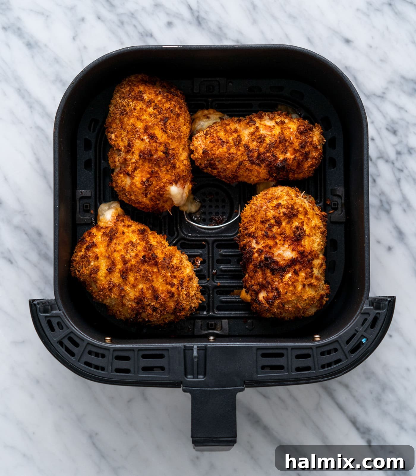 Crispy Air Fryer Chicken Cordon Bleu 16 A freshly air-fried chicken cordon bleu, golden and ready to be served.