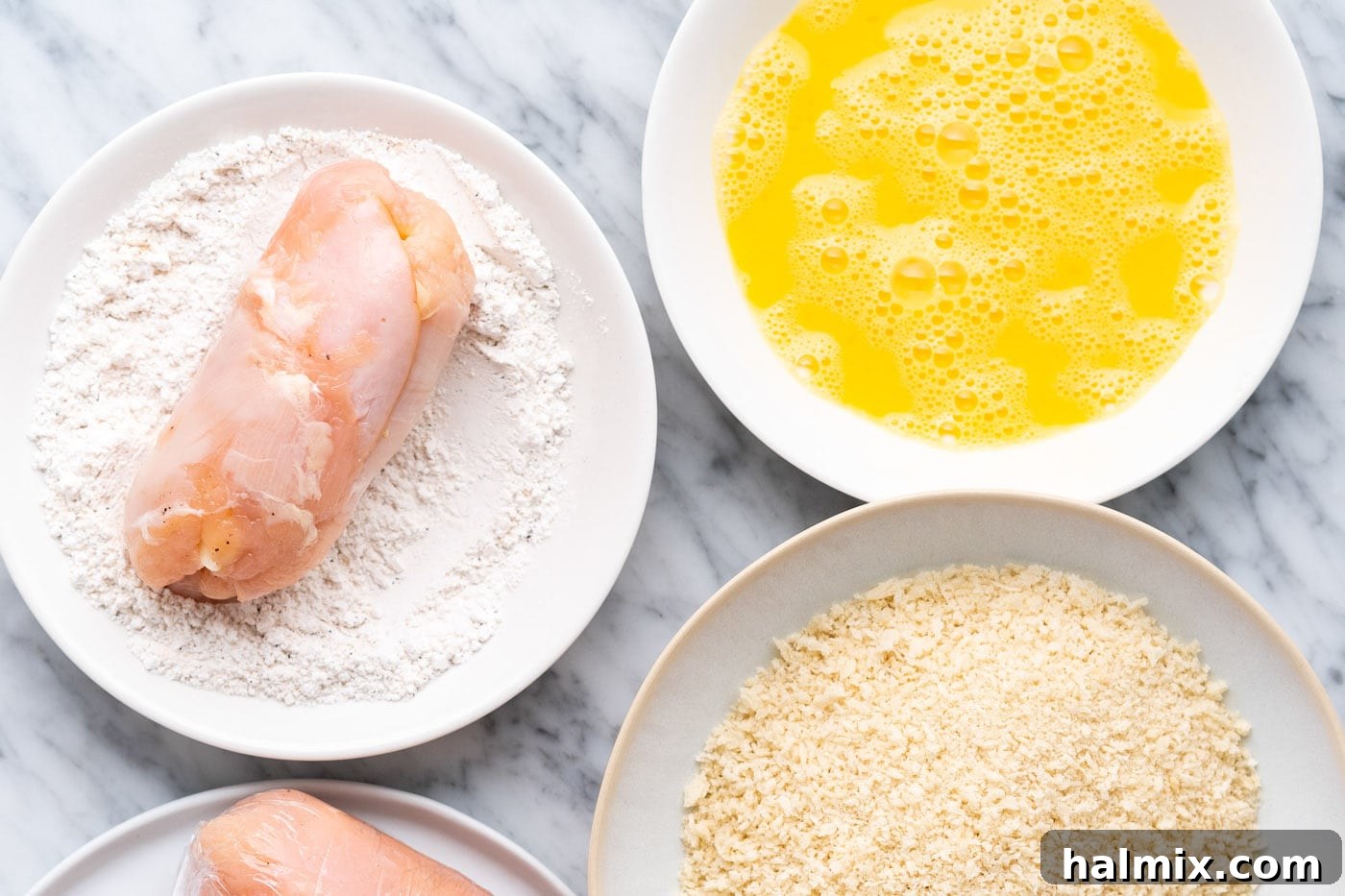 Crispy Air Fryer Chicken Cordon Bleu 10 Coating the chicken cordon bleu in the seasoned flour mixture.