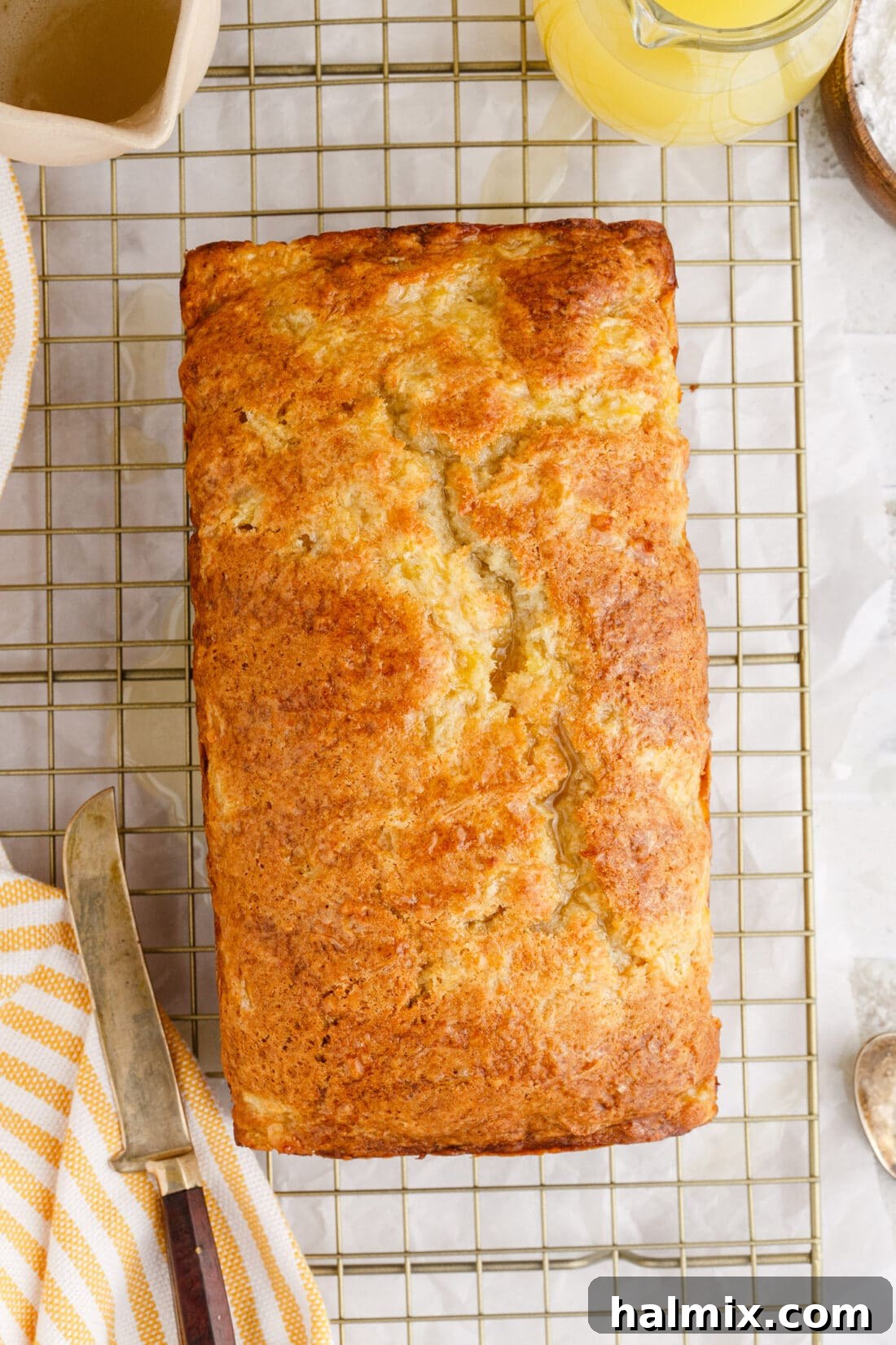 Overhead view of a perfectly baked Pineapple Quick Bread on a cooling rack