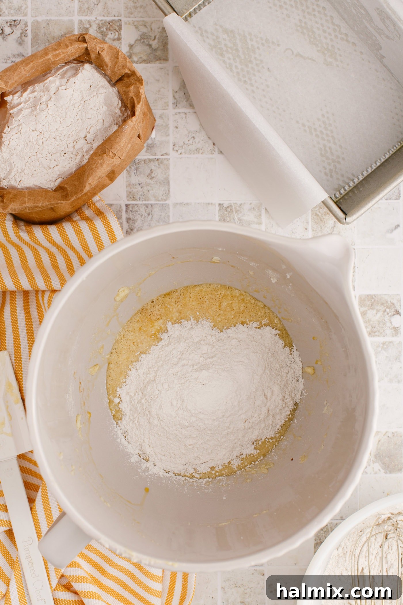 Slowly incorporating the flour mixture into the wet ingredients for Pineapple Quick Bread