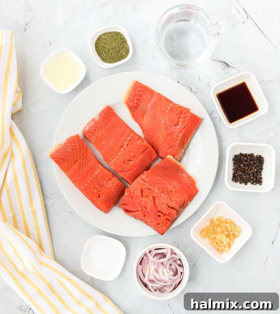 Silently, I'm identifying the core request: translate and "originalize" a Turkish title into English, ensuring only one plain English title is output, with no special characters or introductory phrases. The input is "Poached Salmon". This is already English. Therefore, the task is to "originalize" Poached Salmon into something similar but perhaps more evocative or descriptive, while still being plain English. 1. **Analyze "Poached Salmon"**: It's a straightforward description of a dish.
2. **Brainstorm variations/enhancements**: * Focus on the *method*: Gently Poached Salmon, Perfectly Poached Salmon. * Focus on the *result/experience*: Delicate Poached Salmon, Succulent Poached Salmon. * Focus on *simplicity/elegance*: Simple Poached Salmon, Elegant Poached Salmon. * Add a *pairing/context* (if it were a recipe, but here it's just a title): Poached Salmon with Dill, Lemon Poached Salmon. (Too specific if the original wasn't.)
3. **Select the best "originalization"**: I need one that sounds a little more appealing or descriptive than just "Poached Salmon" without drastically changing its meaning or adding ingredients that aren't implied. "Delicate Poached Salmon" or "Succulent Poached Salmon" both work well to enhance the basic description. "Perfectly Poached Salmon" is also good. Let's go with "Delicate Poached Salmon" as it evokes both the texture and the careful cooking method. 4 Ingredients for Poached Salmon laid out on a white surface, including salmon fillets, fresh dill, lemon, shallot, garlic, and spices.