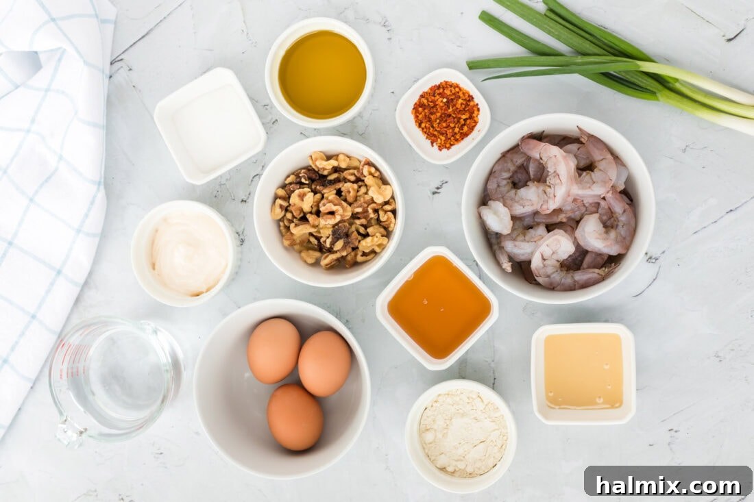 Golden Glazed Honey Walnut Shrimp 4 A selection of fresh ingredients laid out, including shrimp, walnuts, and sauce components for Honey Walnut Shrimp