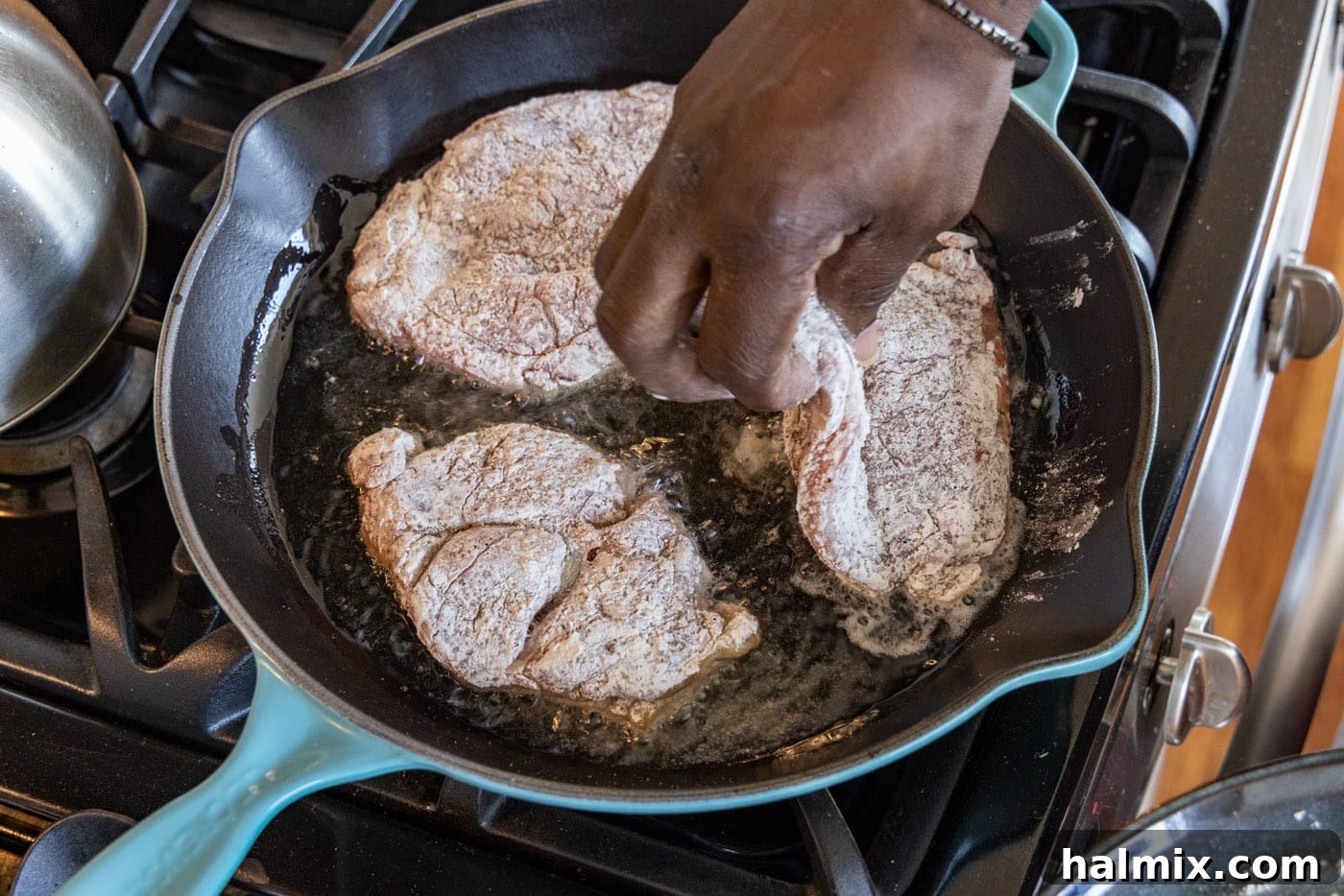 Tender Veal Cutlets with Lemon Caper Sauce 6 adding veal cutlets to a skillet