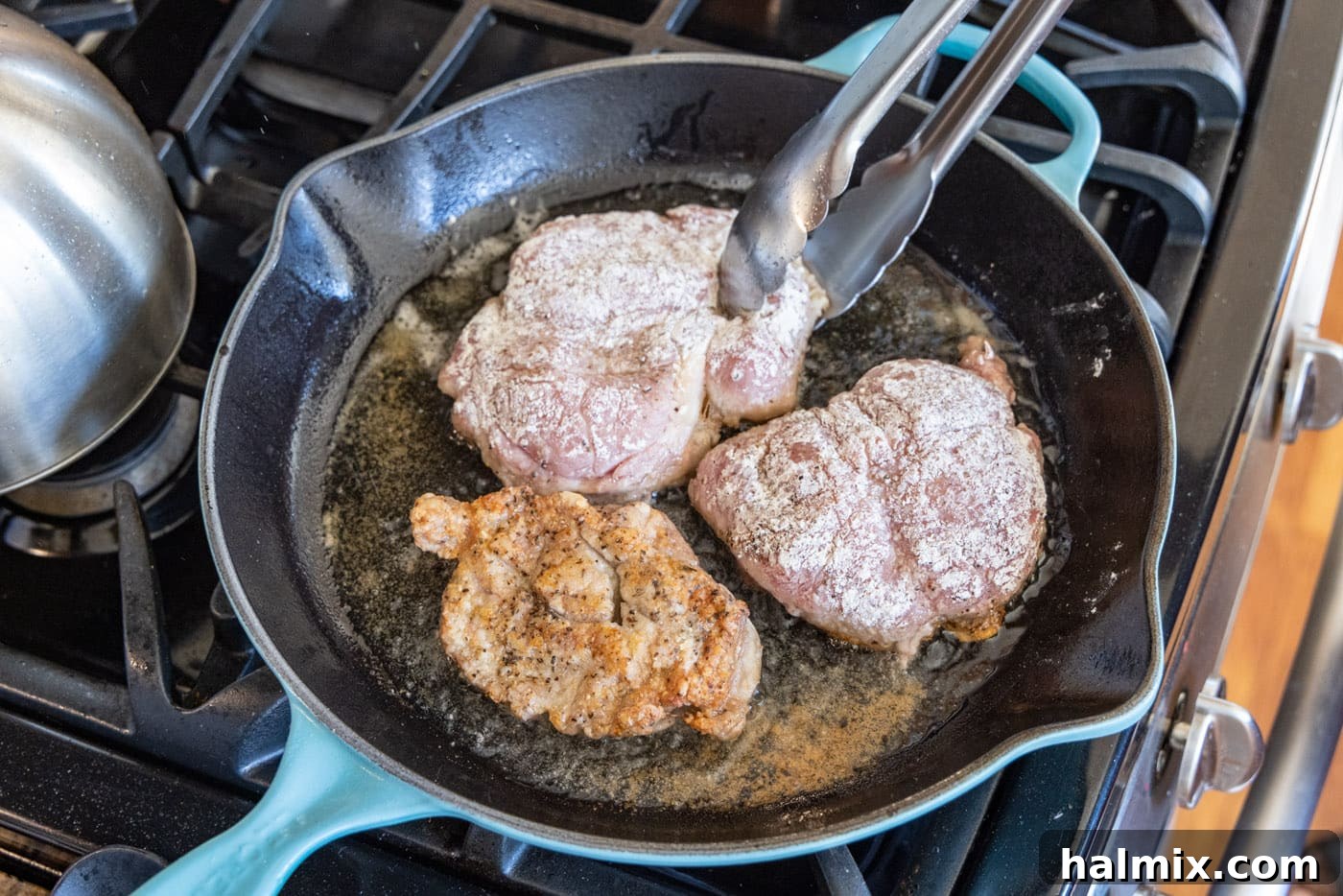 Tender Veal Cutlets with Lemon Caper Sauce 7 flipping flour dredged veal in a skillet