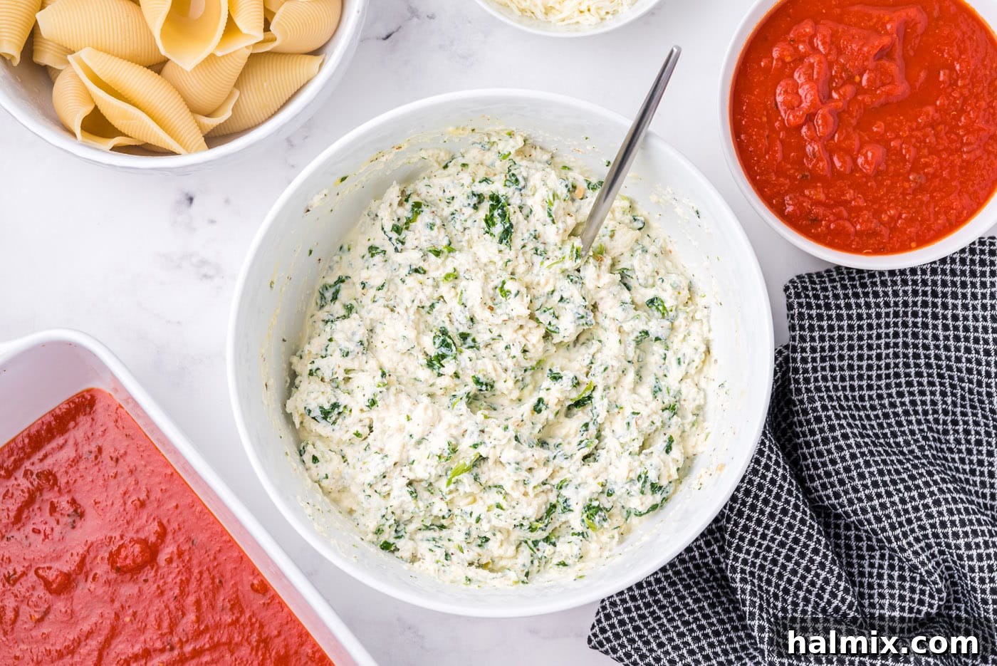ricotta, parmesan, and spinach mixed in a bowl