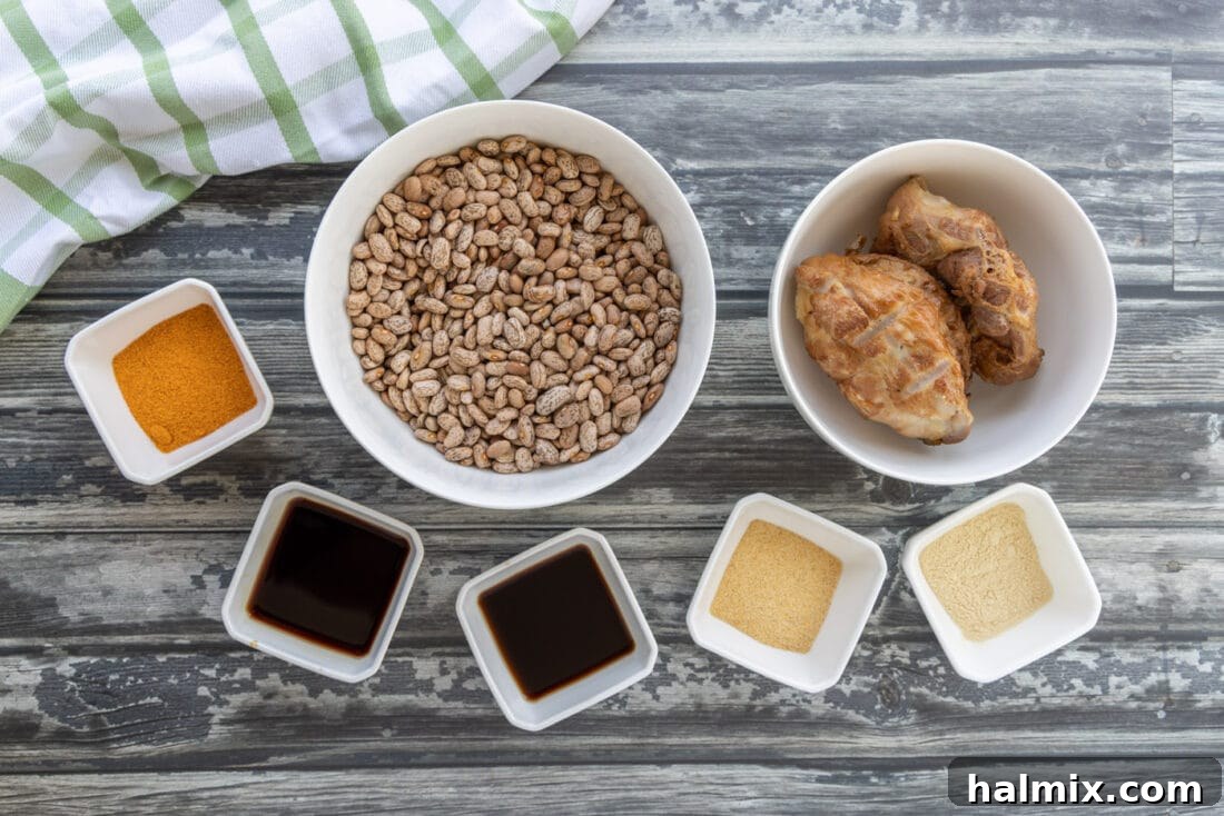 All ingredients for Slow Cooker Pinto Beans laid out on a table