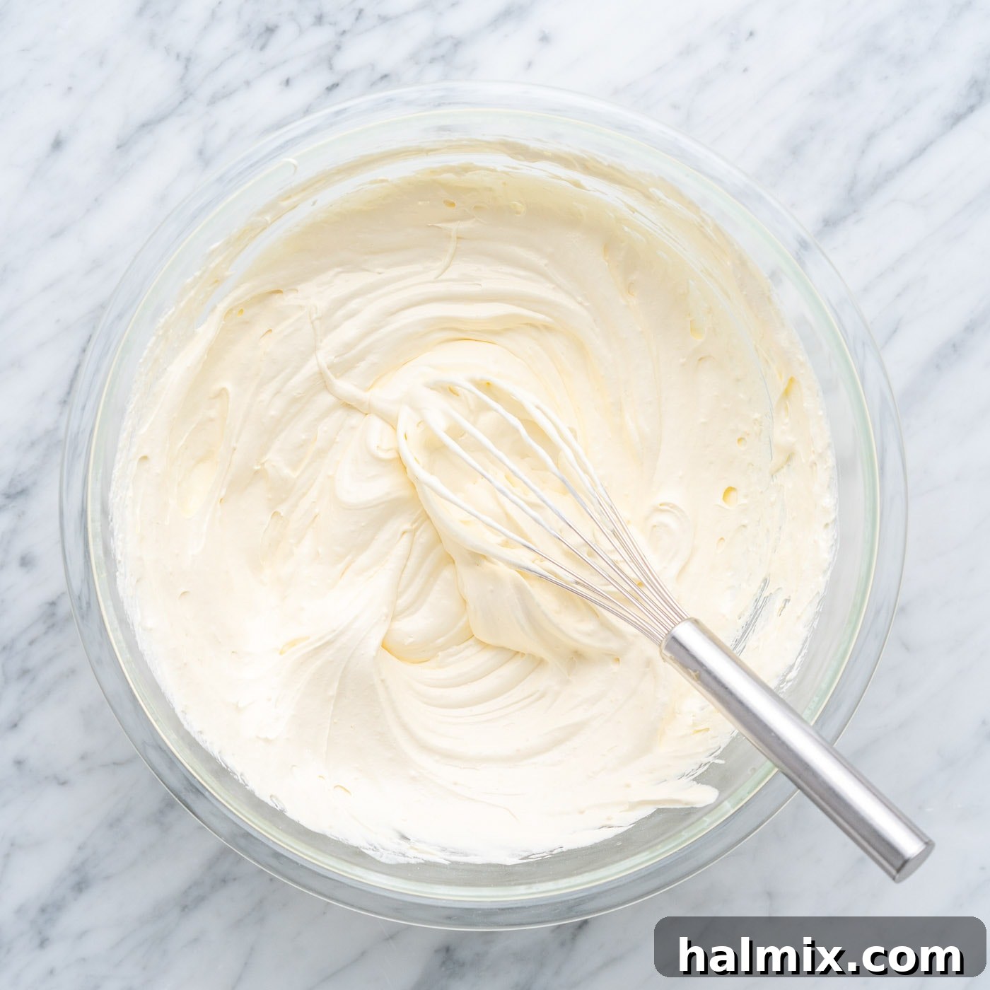 Sun-Kissed Pineapple Dream 11 the finished pineapple frosting in a bowl, light and fluffy
