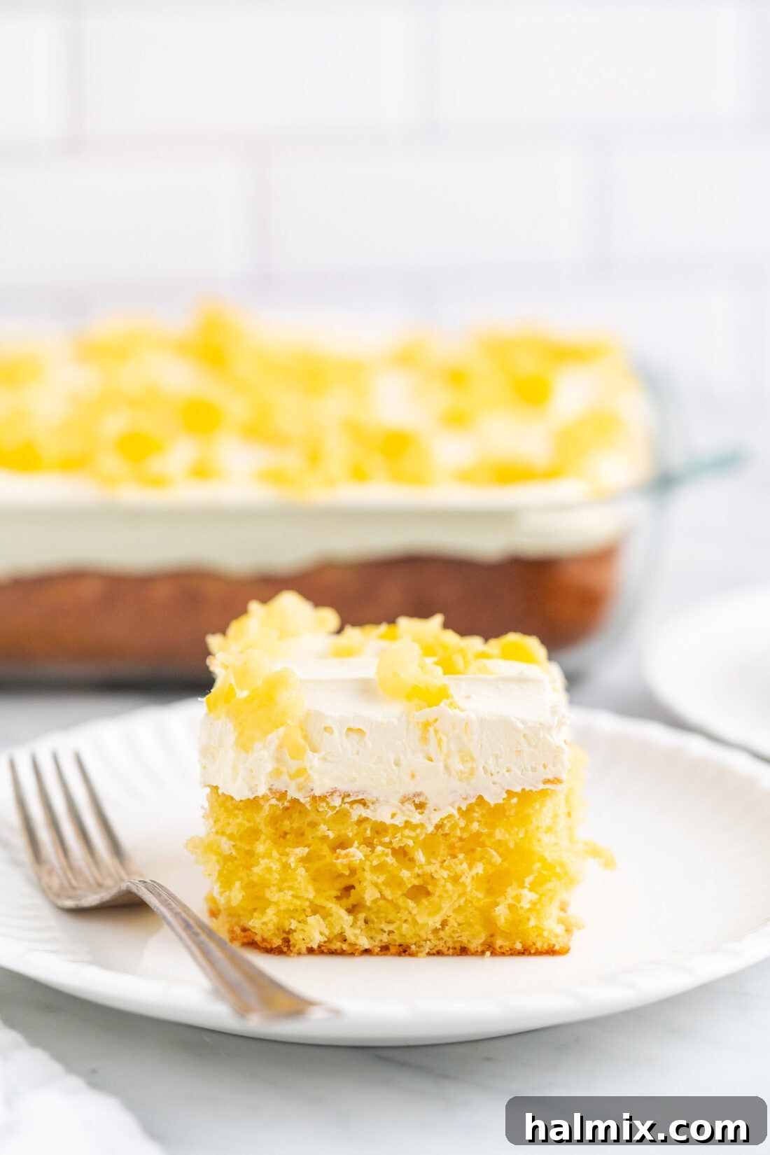 Sun-Kissed Pineapple Dream 3 a perfect slice of Pineapple Sunshine Cake, ready to be enjoyed