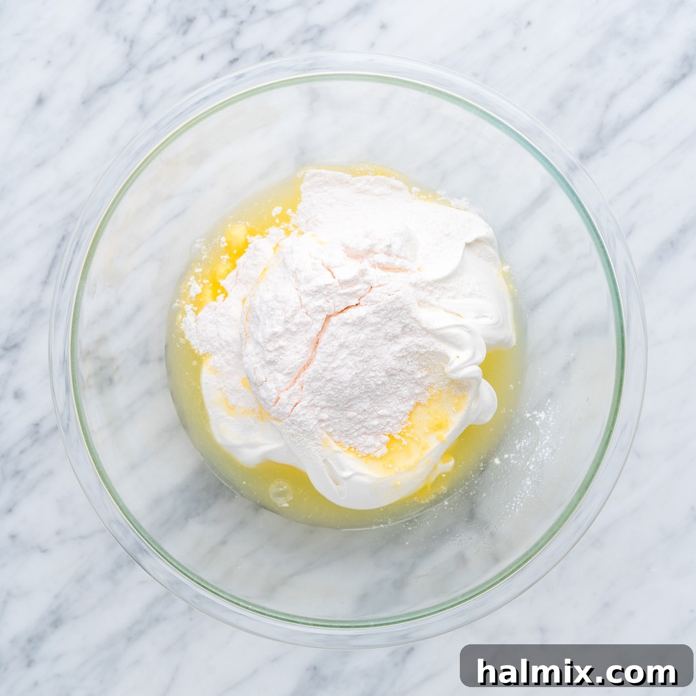 Sun-Kissed Pineapple Dream 10 pineapple juice, whipped cream, and instant vanilla pudding mix in a bowl, ready to be combined