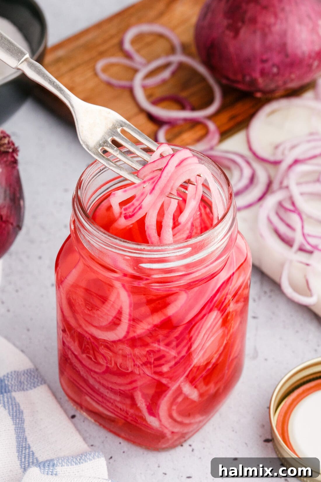 taking Pickled Onions out of jar with a fork