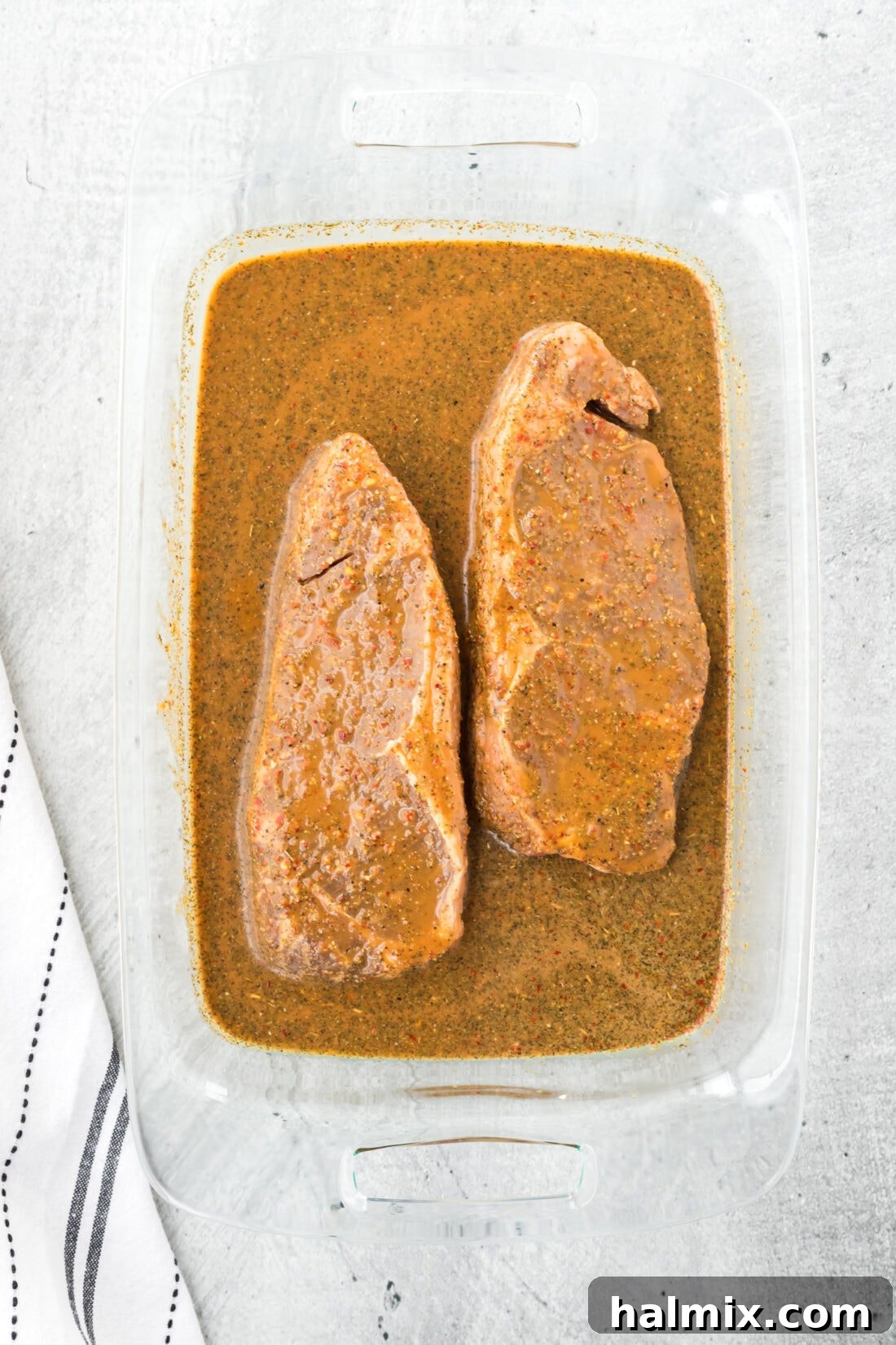 The Ultimate Steak Upgrade 6 A container filled with a rich, dark steak marinade, ready for future use or to marinate more beef.