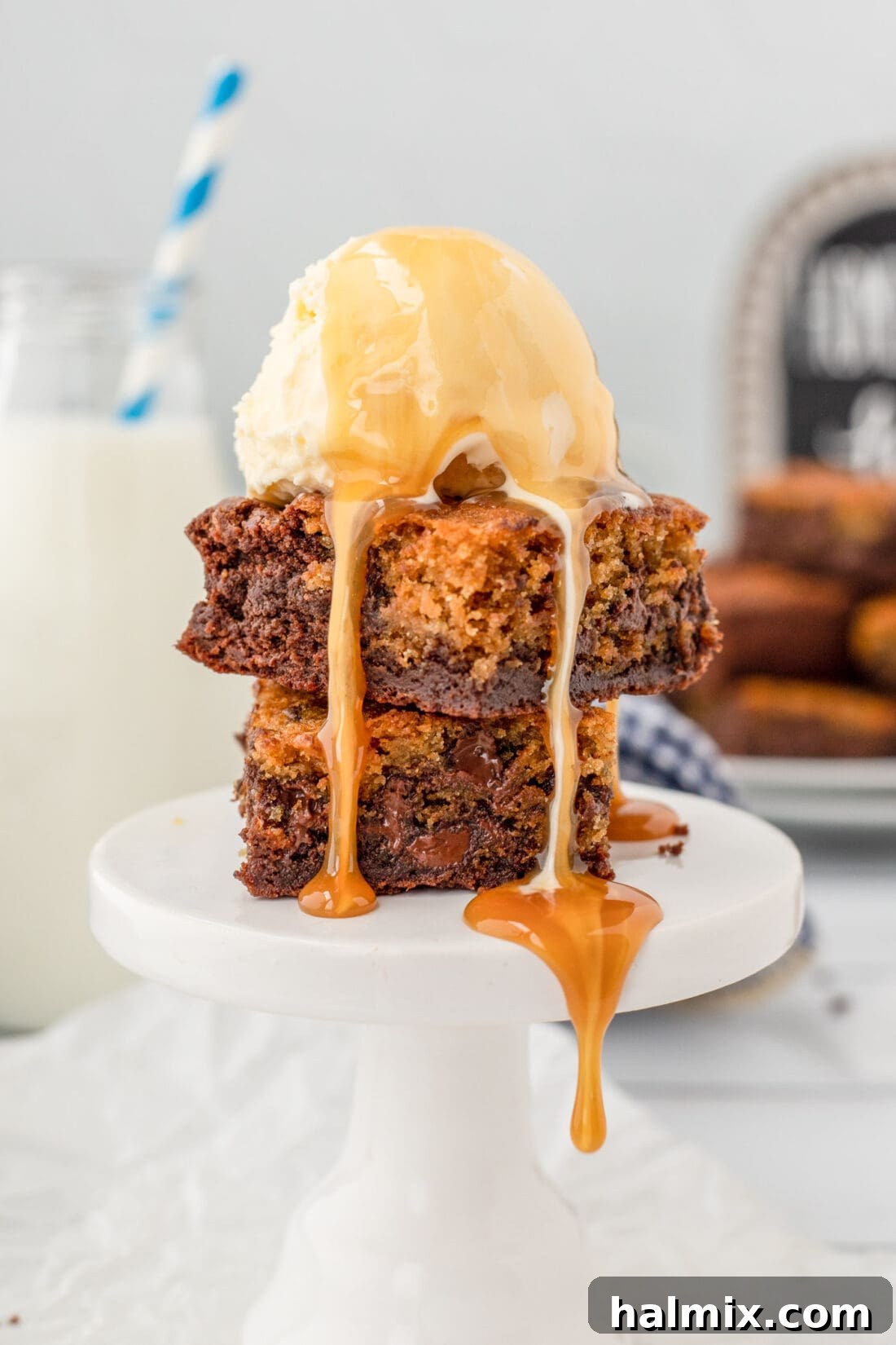 Warm Brookies served with a generous scoop of vanilla ice cream, adorned with a sweet drizzle