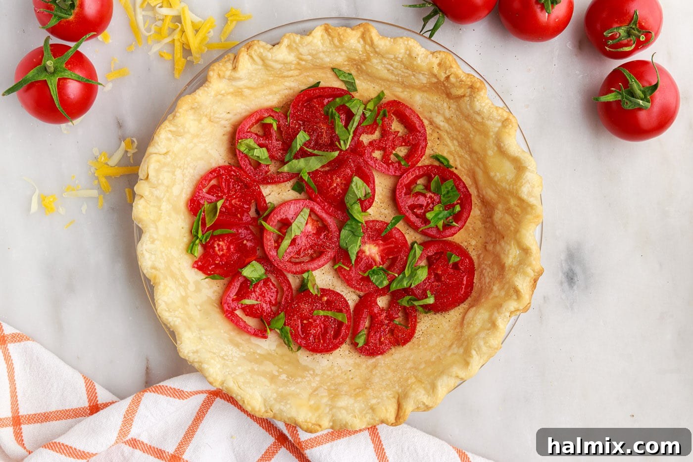 chopped basil on top of tomato pie layers