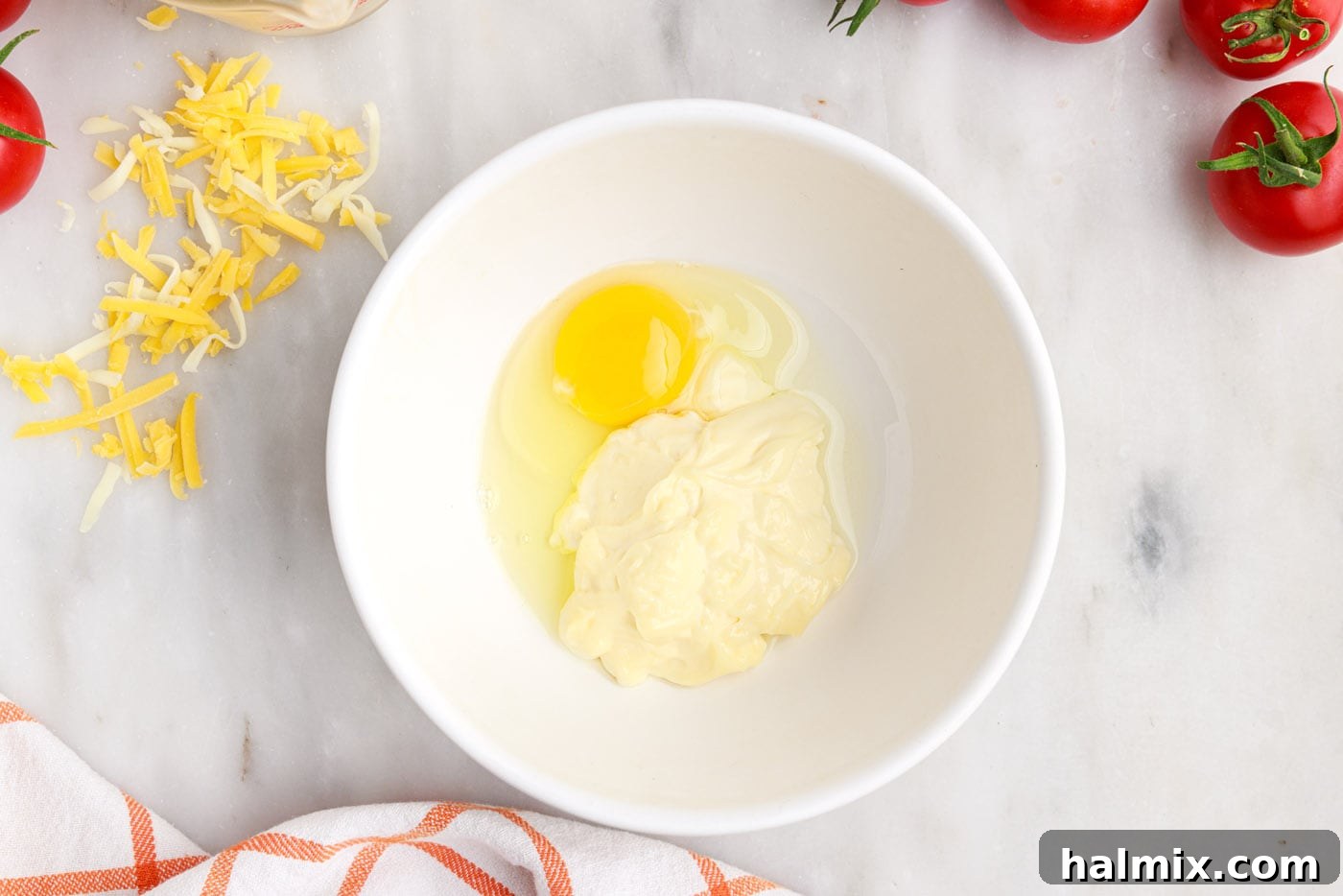 mayo and egg in a bowl for tomato pie